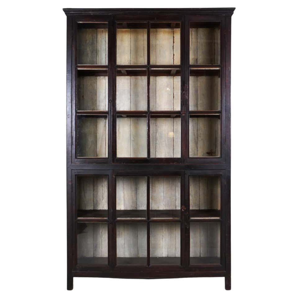 A British Colonial Bookcase with Bottom Storage For Sale at 1stDibs