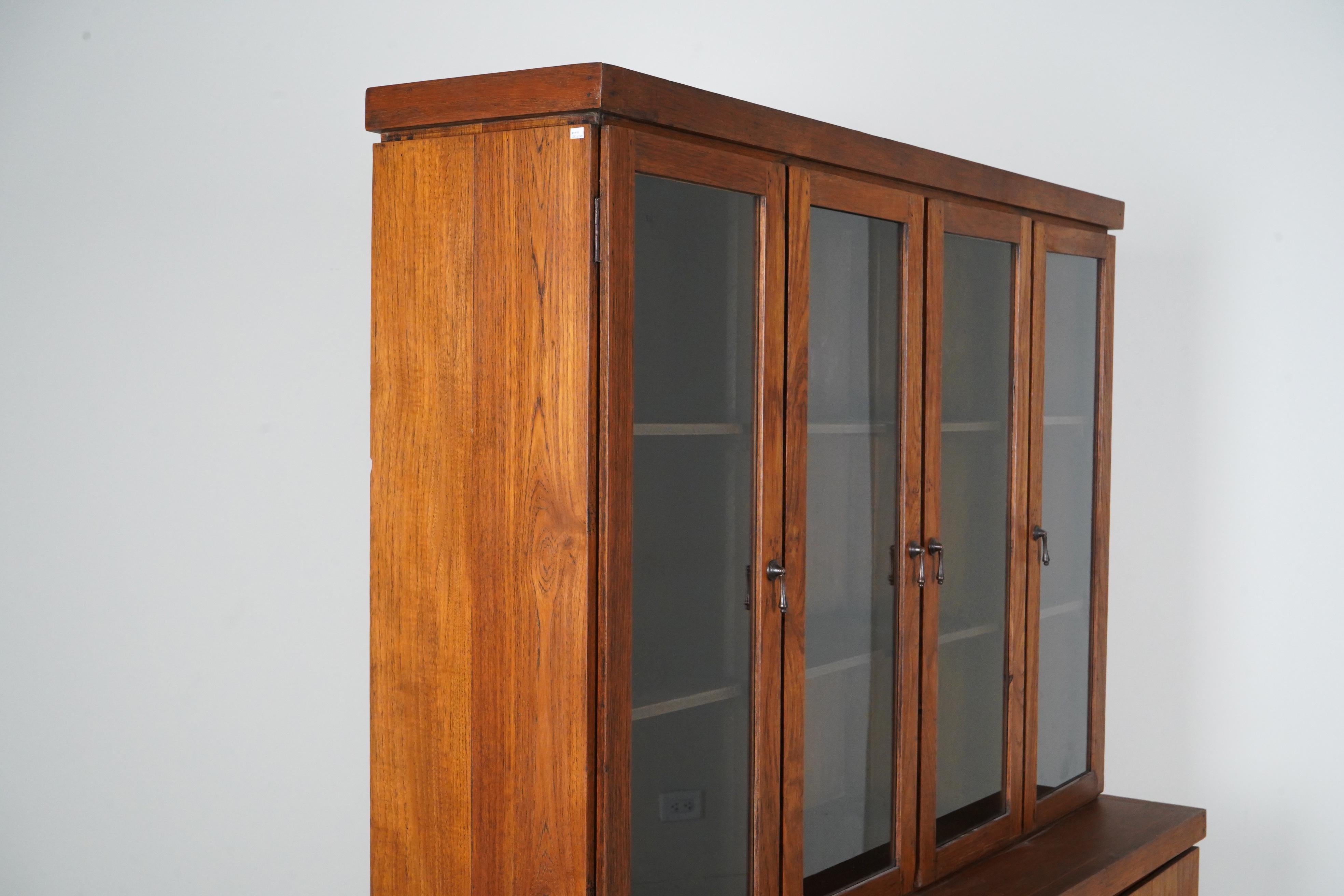 A British Colonial Bookcase with Bottom Storage For Sale 5