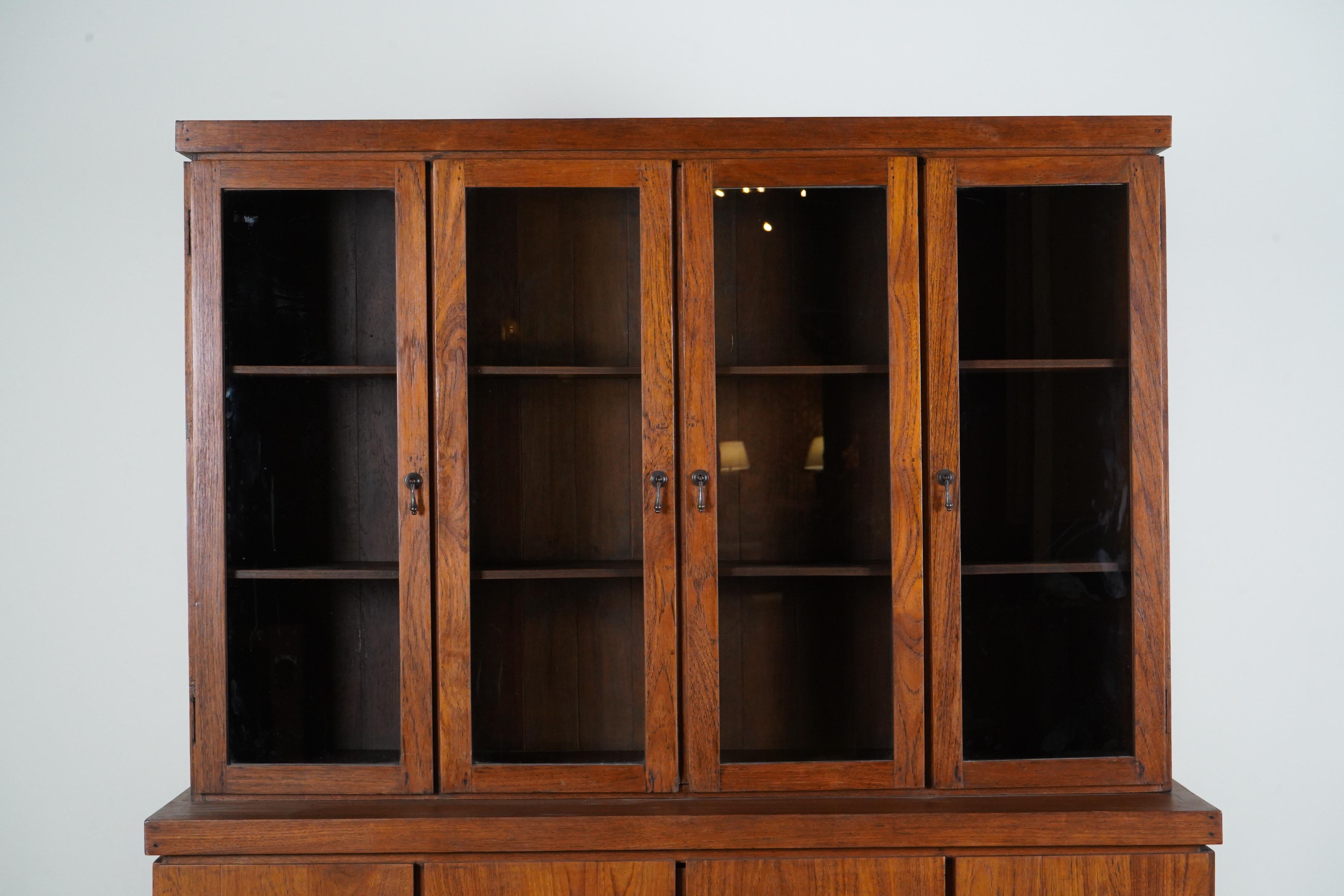 Teak A British Colonial Bookcase with Bottom Storage For Sale