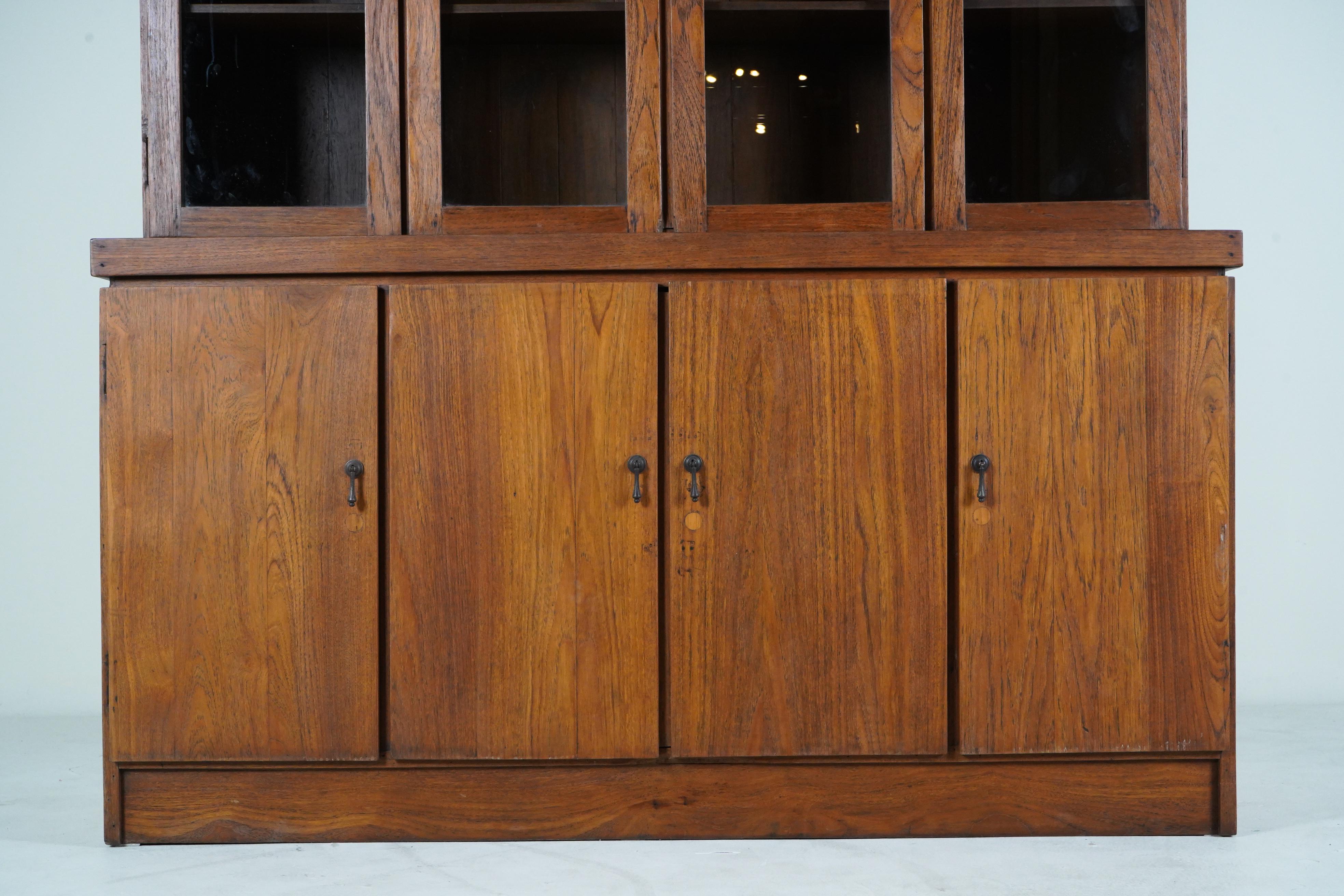 A British Colonial Bookcase with Bottom Storage For Sale 1