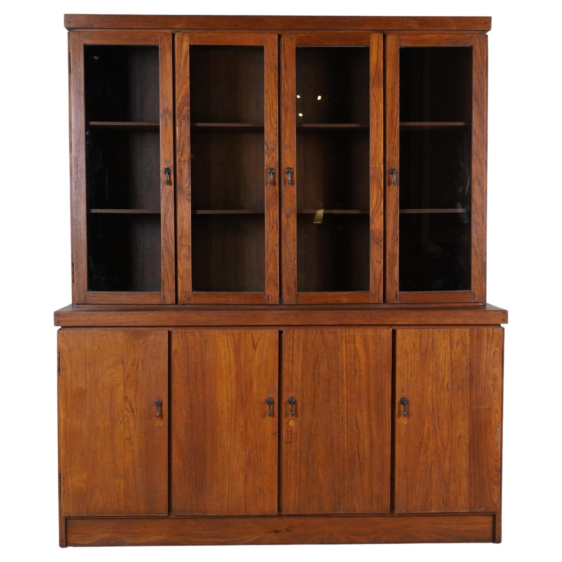 A British Colonial Bookcase with Bottom Storage For Sale
