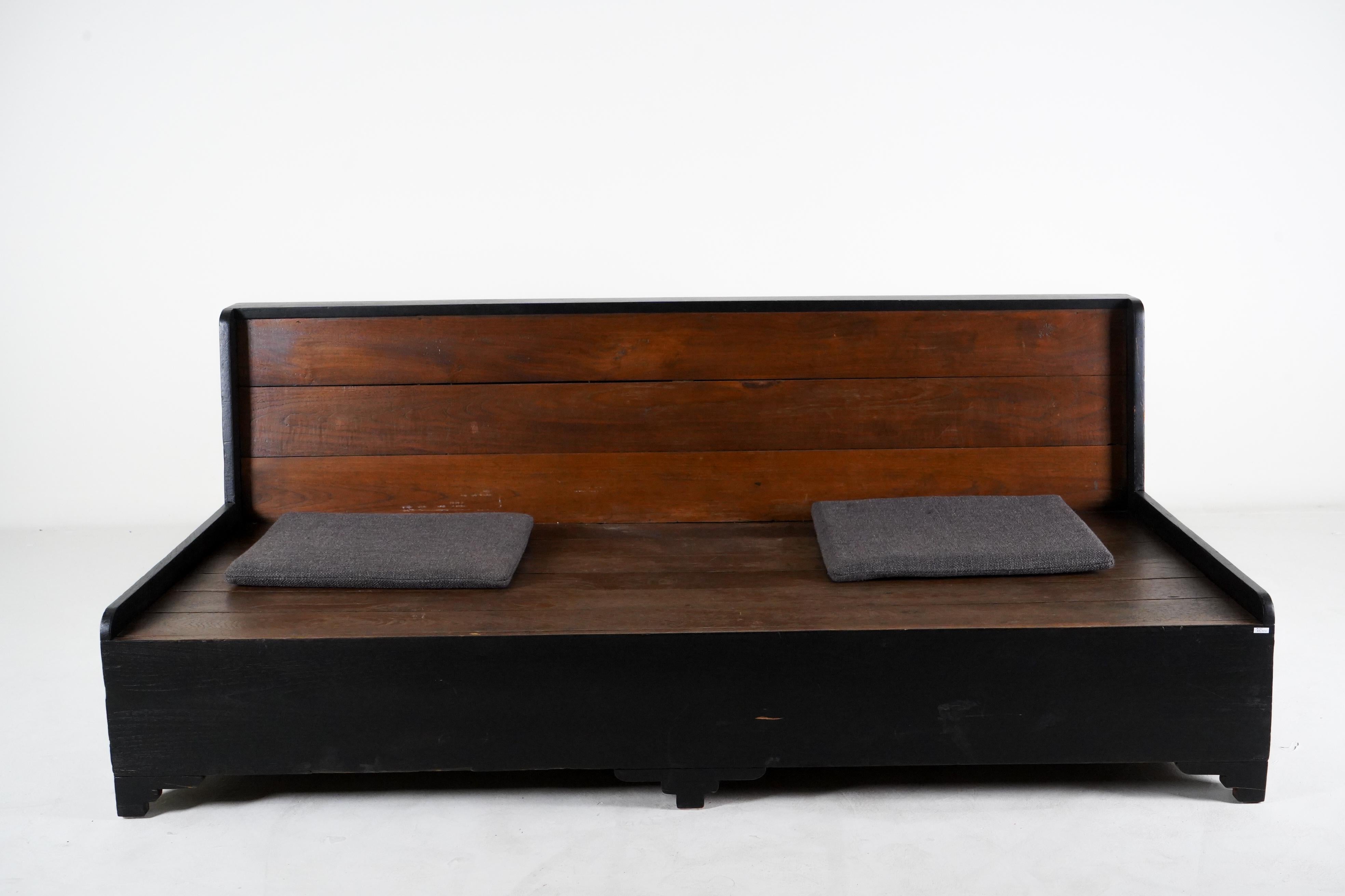 This British colonial era daybed in made from teak and dates to the 1930's. During the British Empire in Burma much furniture was made in the Anglo-Indian style using native hardwoods and local craftsmen. Styles closely matched European ones of the