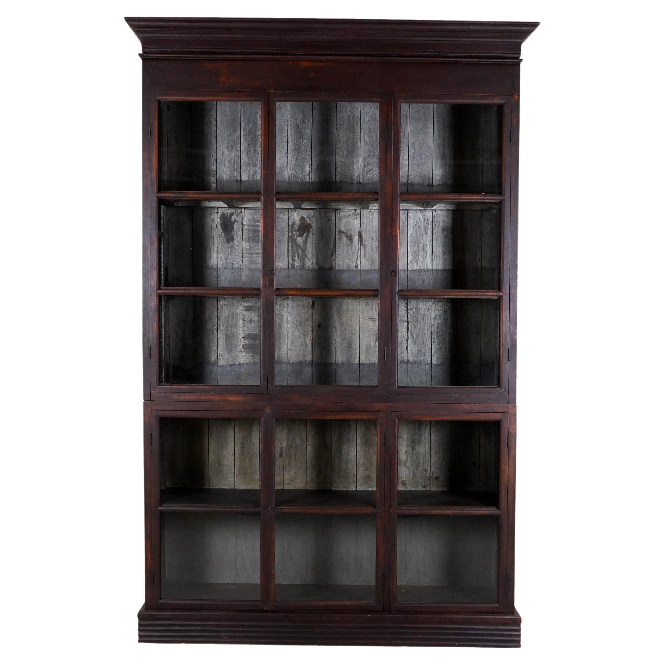 A British Colonial Teak Wood Bookcase For Sale