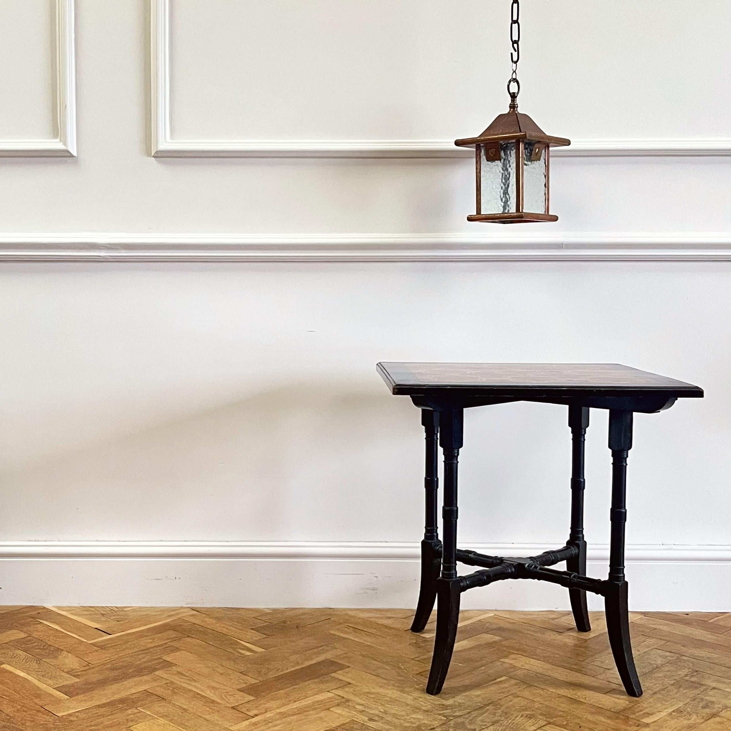 An attractive British designed drinks table, the top inlaid with native timbers, laid out in a motif reminiscent of designs from Owen Jones’ The Grammar of Ornament.

British, Late Nineteenth Century

H 65 x W 60.3 x D 60.3 cms