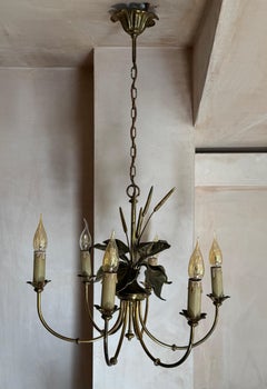 A bronze chandelier attributed to Maison Charles