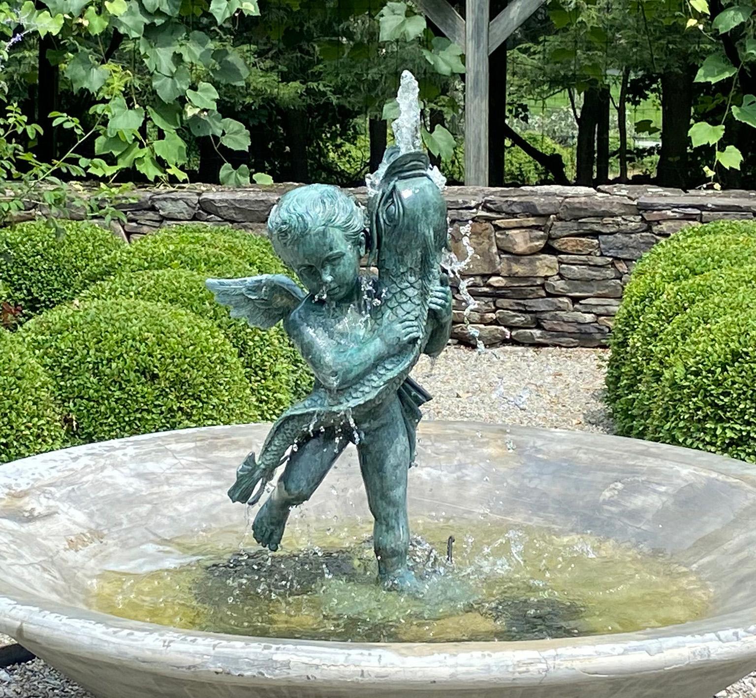 Renaissance A Bronze Cherub Holding a Fish For Sale