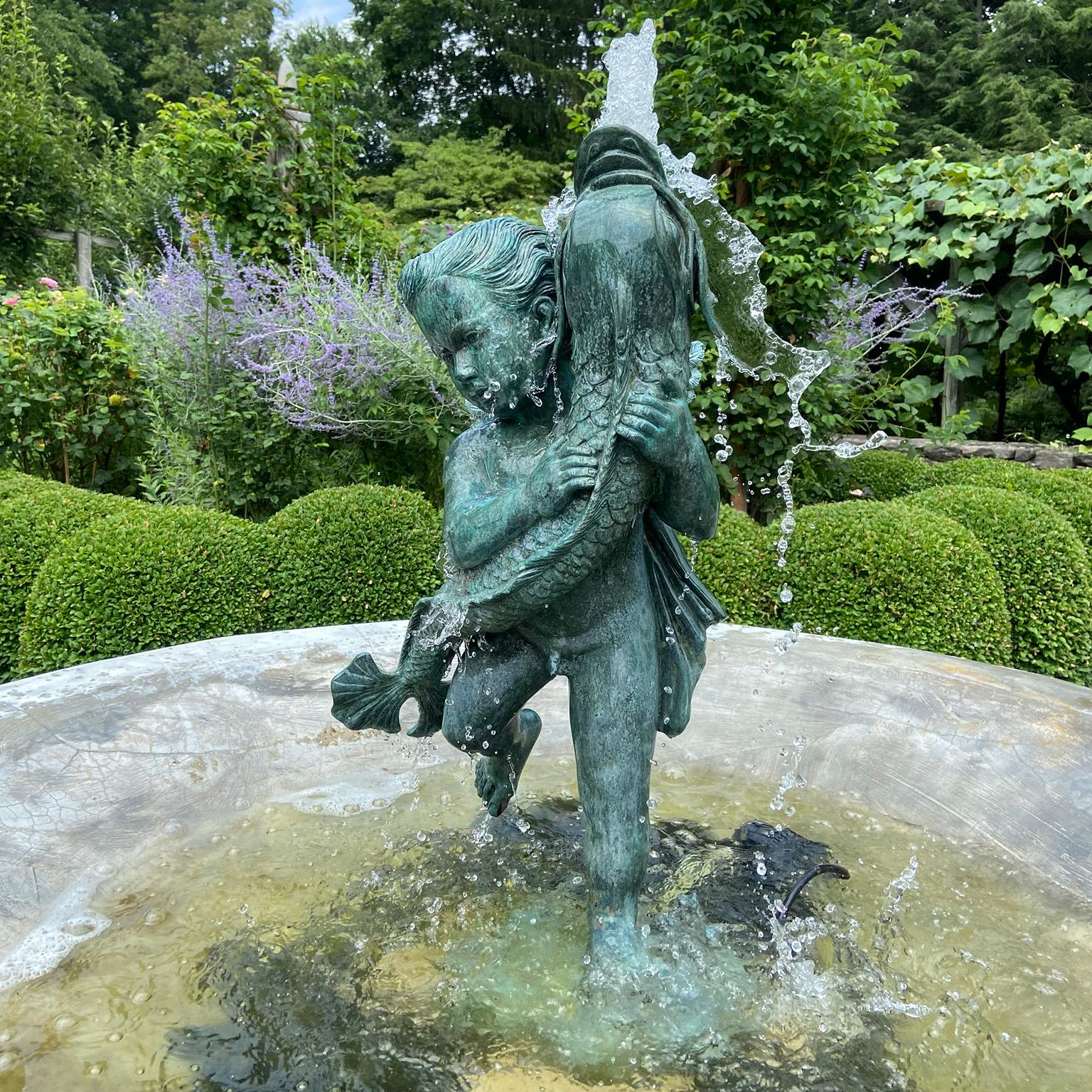 Cast A Bronze Cherub Holding a Fish For Sale
