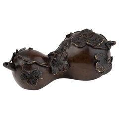 A Bronze cucurbit sculpture designed to be used as a watterdropper or suiteki