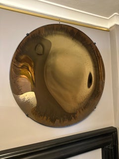 A Bronze Distressed Concave Circular Mirror