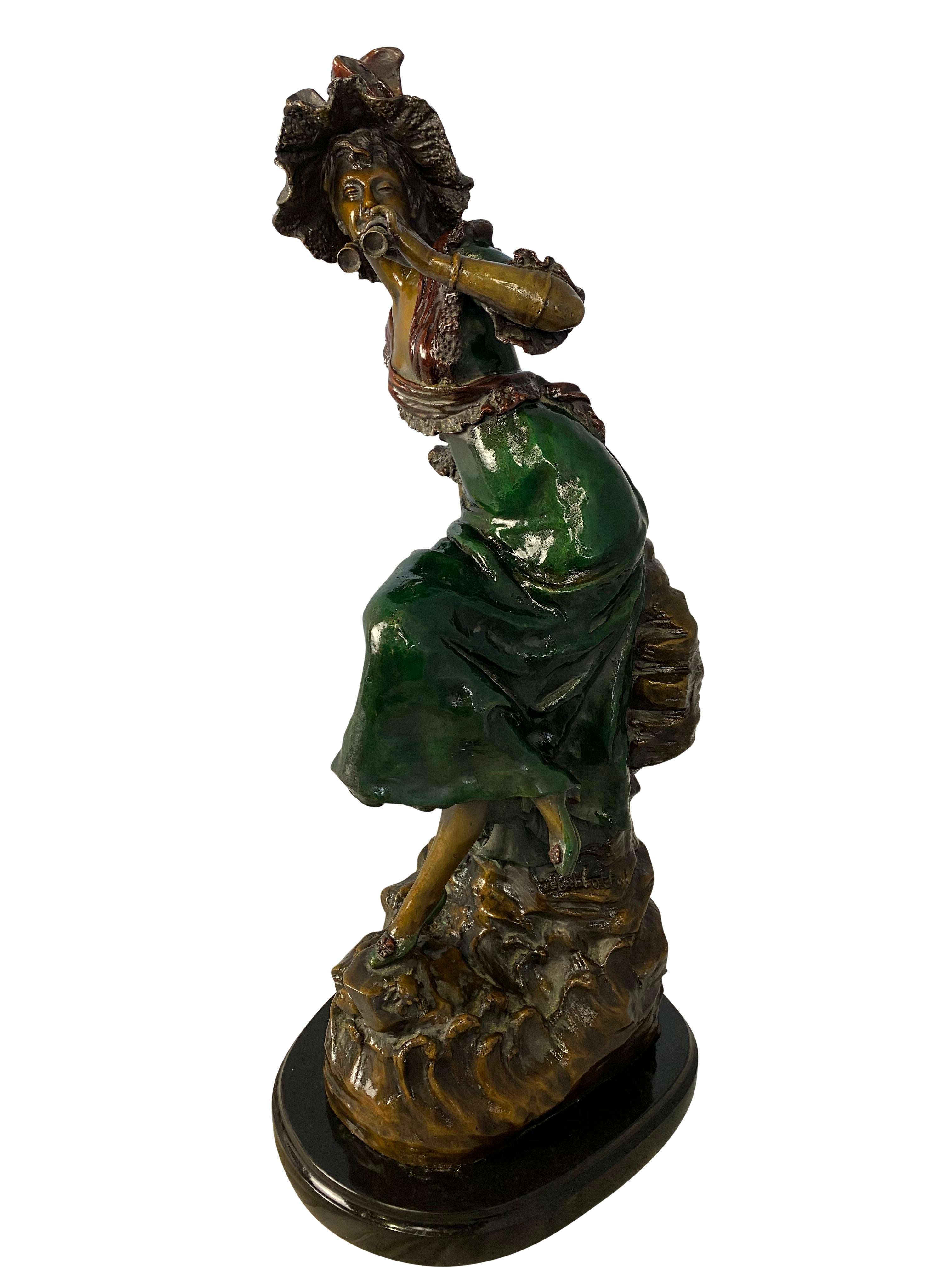 A fine 20th century statue of a two-tone patina bronze woman dressed in Classic Victorian clothing, holding a pair of theatre binoculars. Signed by the French artist Louis Hottot beneath the green dress. 

Dimensions (cm)
72 H/27 W/32 D.