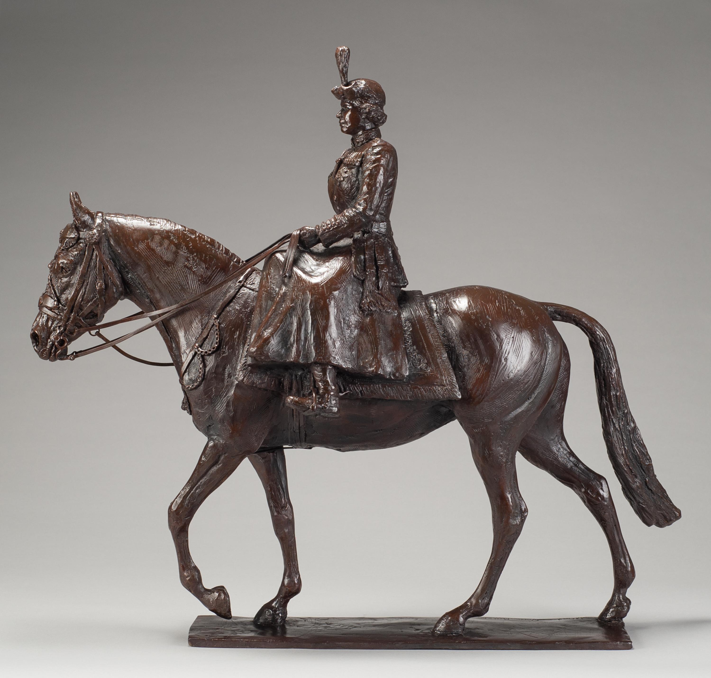 A bronze of Queen Elizabeth II Trooping the Colour by Amy Goodman and Vivien Mallock, 2022. This equestrian statuette was created for Queen Elizabeth II’s Platinum Jubilee.  Riding the famous mare Burmese, side saddle, she is shown as