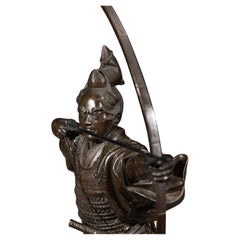 A bronze okimono depicting a samurai archer, signed Yoshimitsu