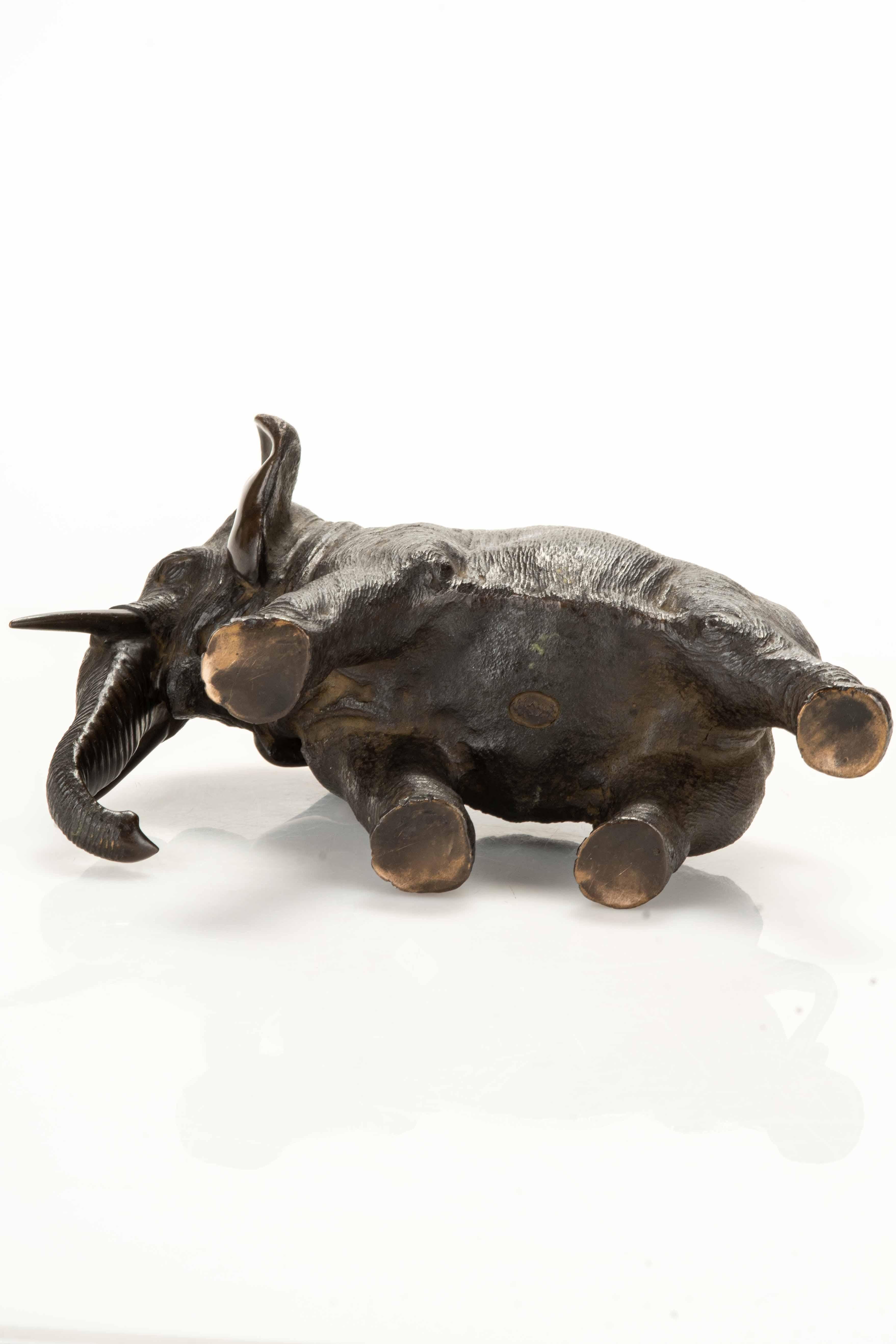 19th Century A bronze okimono depicting a walking elephant For Sale