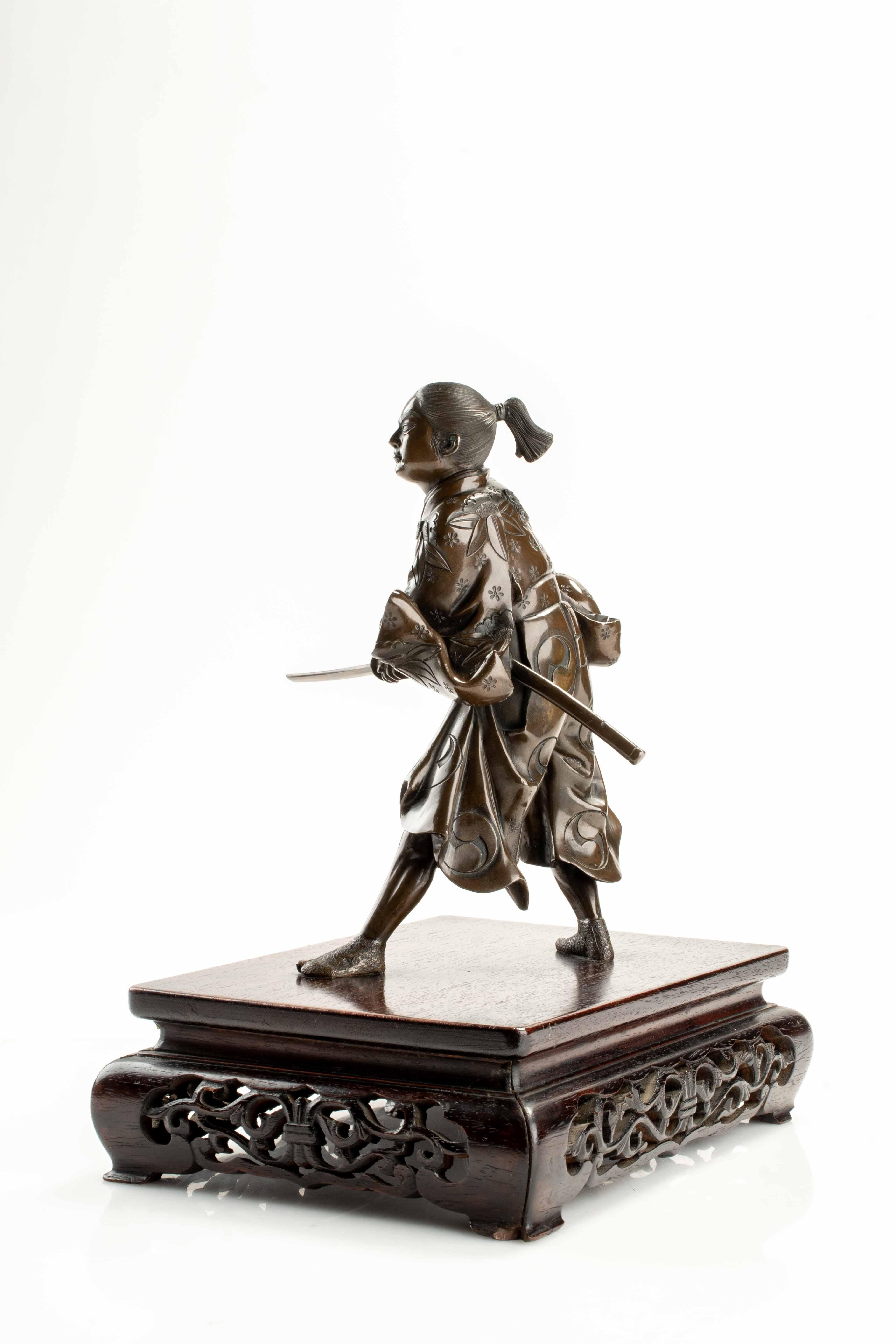 Japanese A bronze okimono depicting a young samurai with a katana, signed Yoshimitsu For Sale