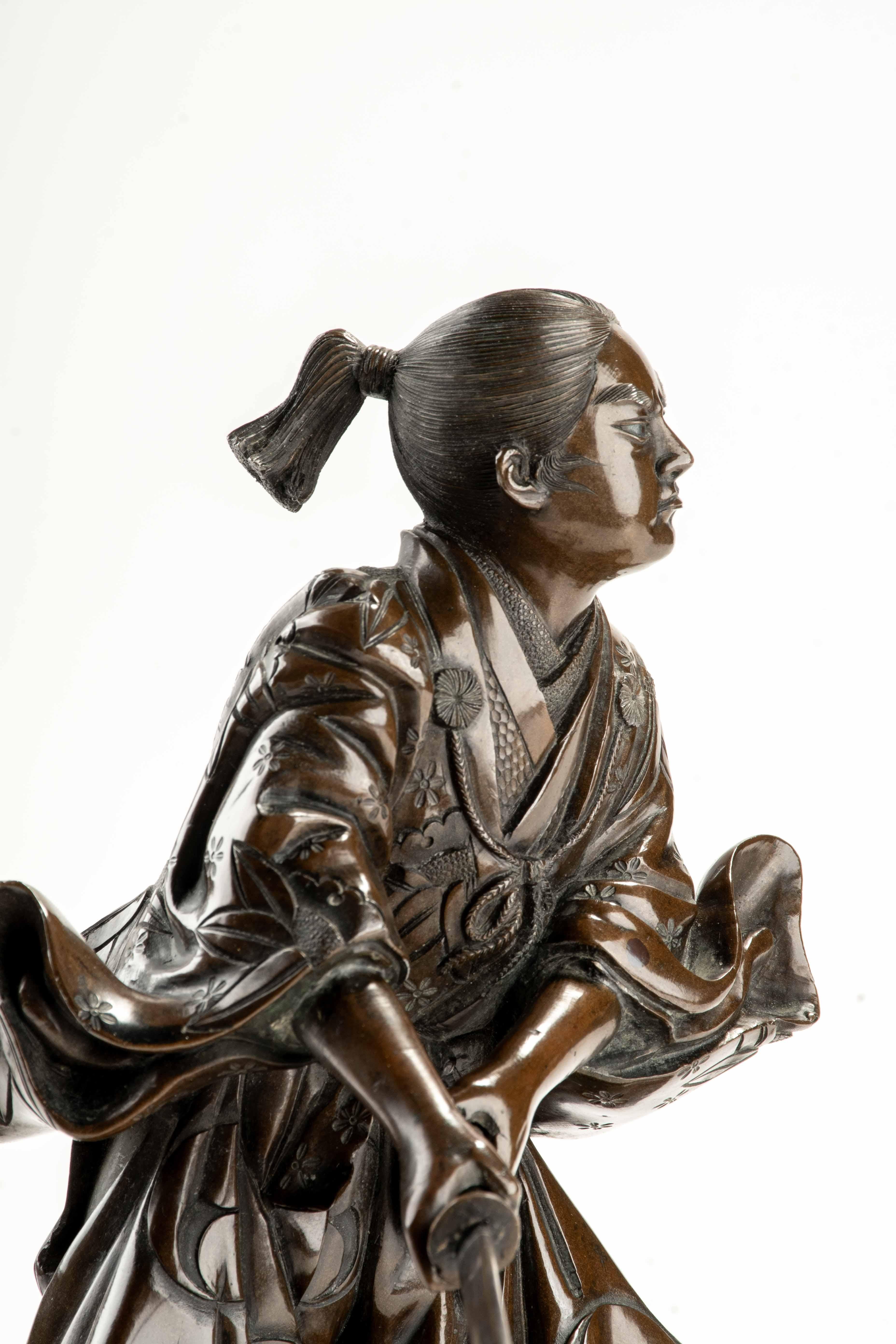 Bronze A bronze okimono depicting a young samurai with a katana, signed Yoshimitsu For Sale