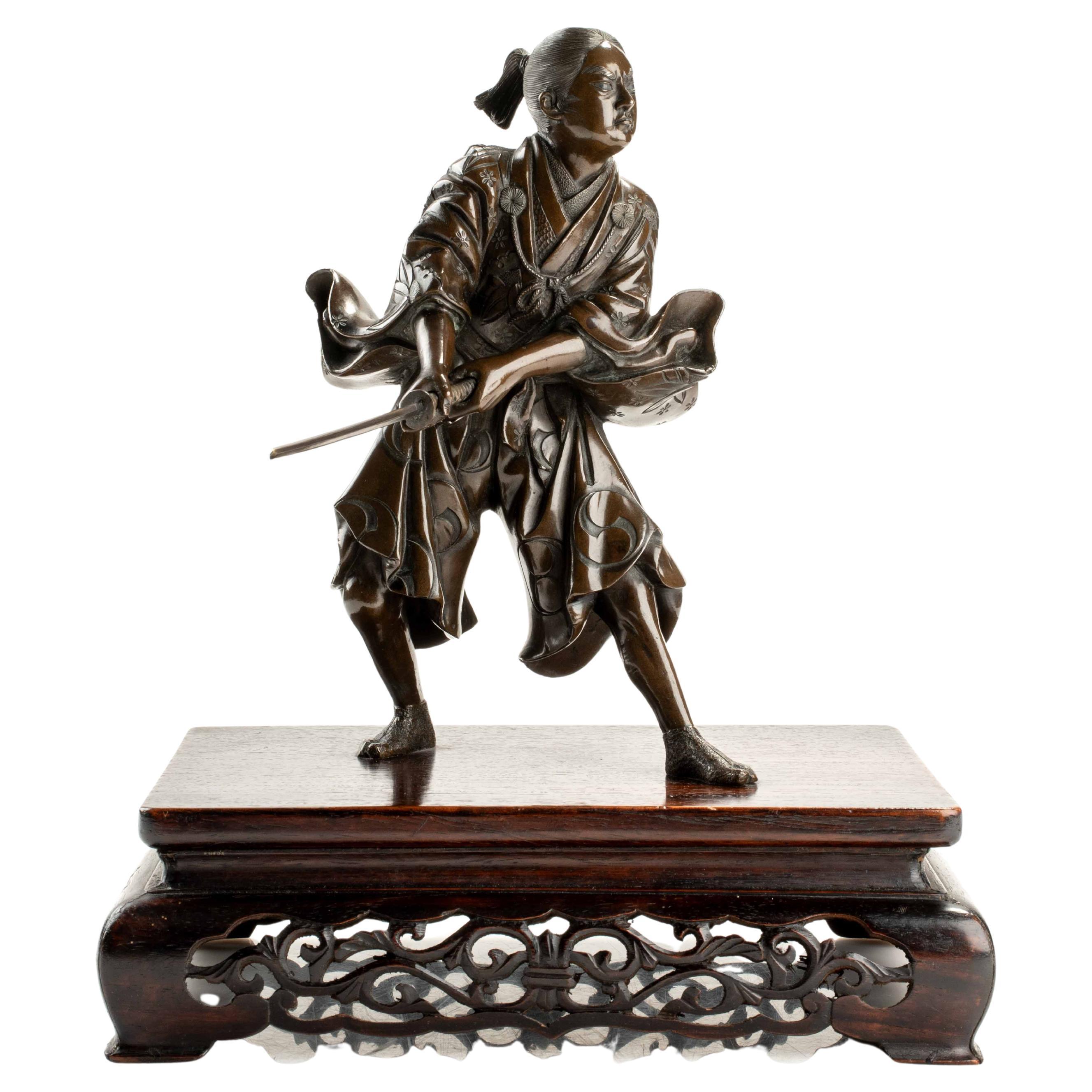A bronze okimono depicting a young samurai with a katana, signed Yoshimitsu For Sale