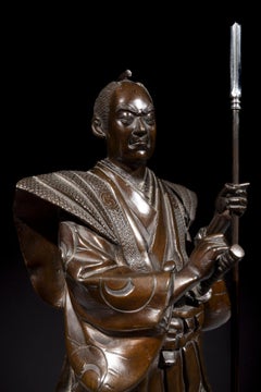 A bronze okimono of a samurai with a yari and katana, signed Gyokko