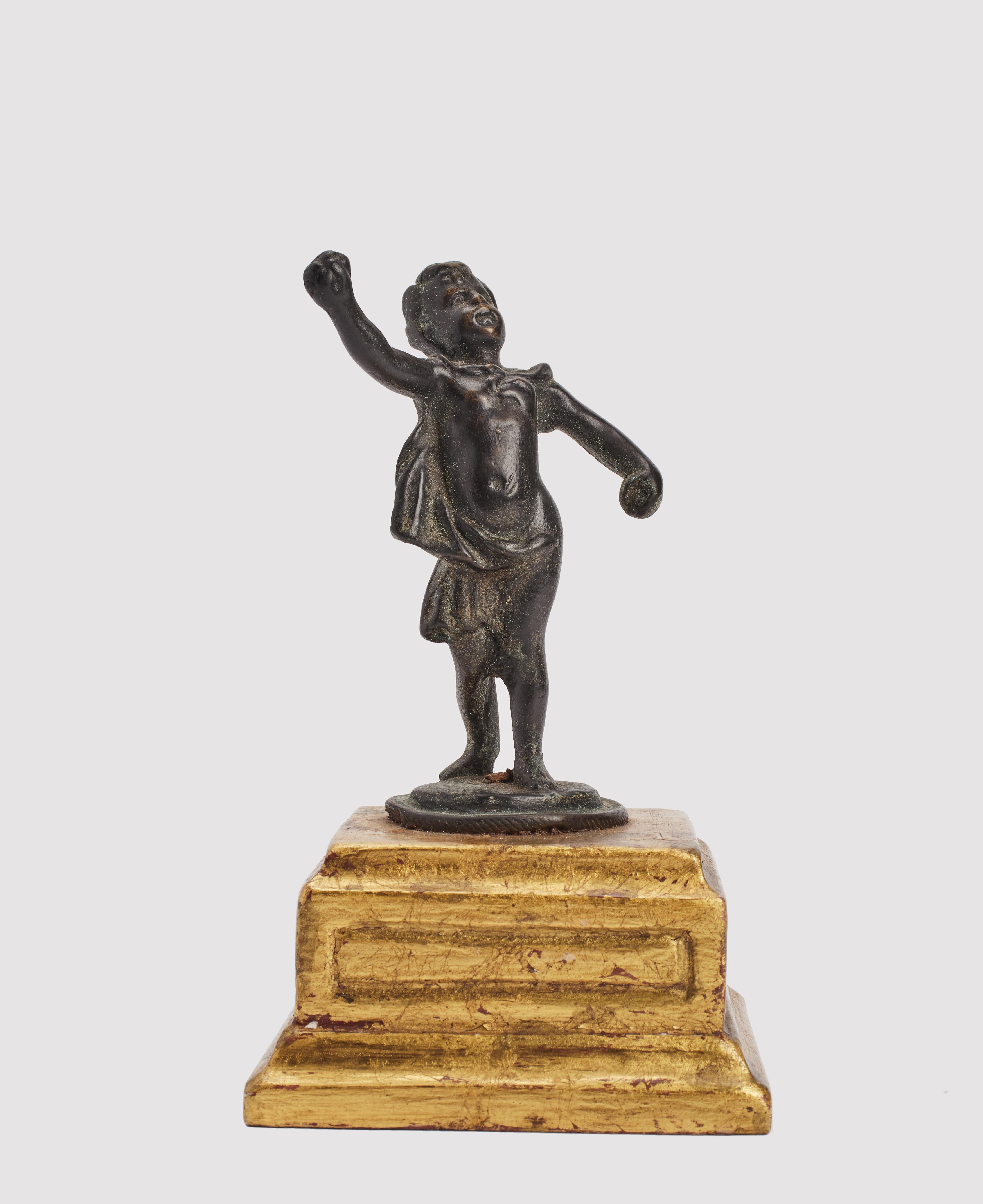 Bronze sculpture depicting a putto gold gilt wooden base. Italy last part of 19th century. 