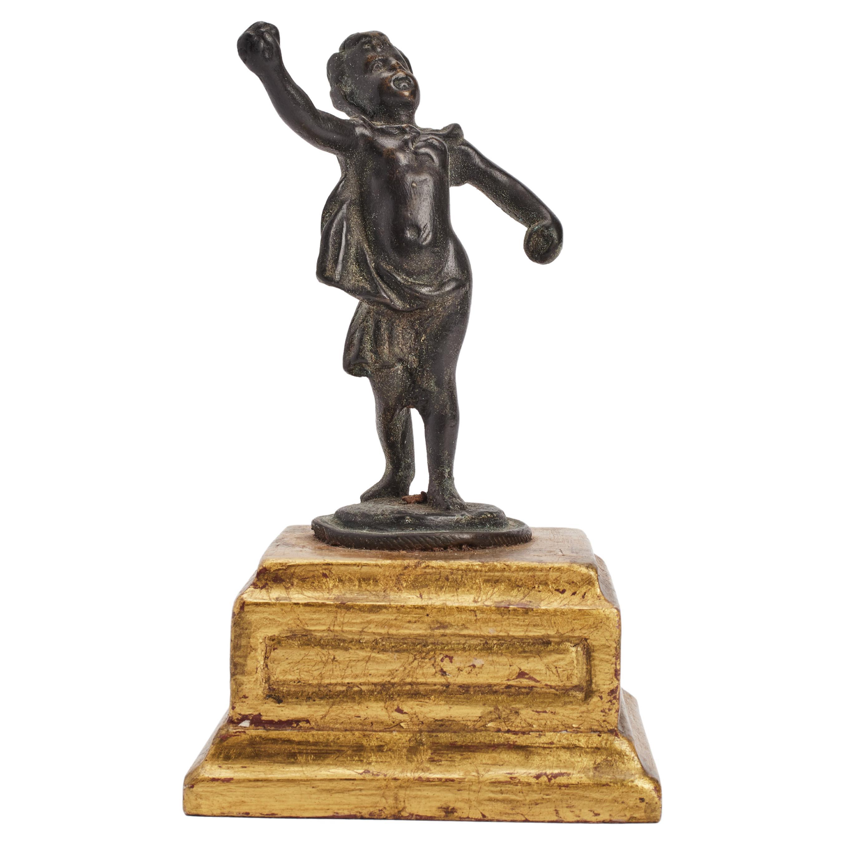 A bronze sculpture depicting a putto, Italy 1870. For Sale