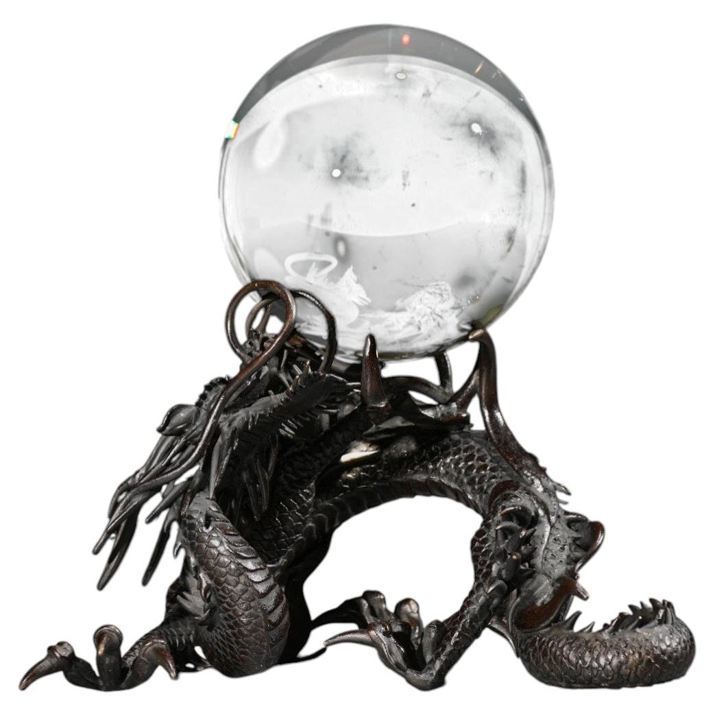A bronze sculpture of a Ryu dragon with a sacred jewel
