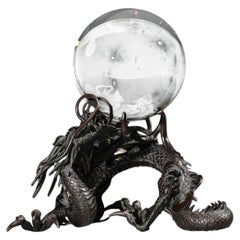 A bronze sculpture of a Ryu dragon with a sacred jewel