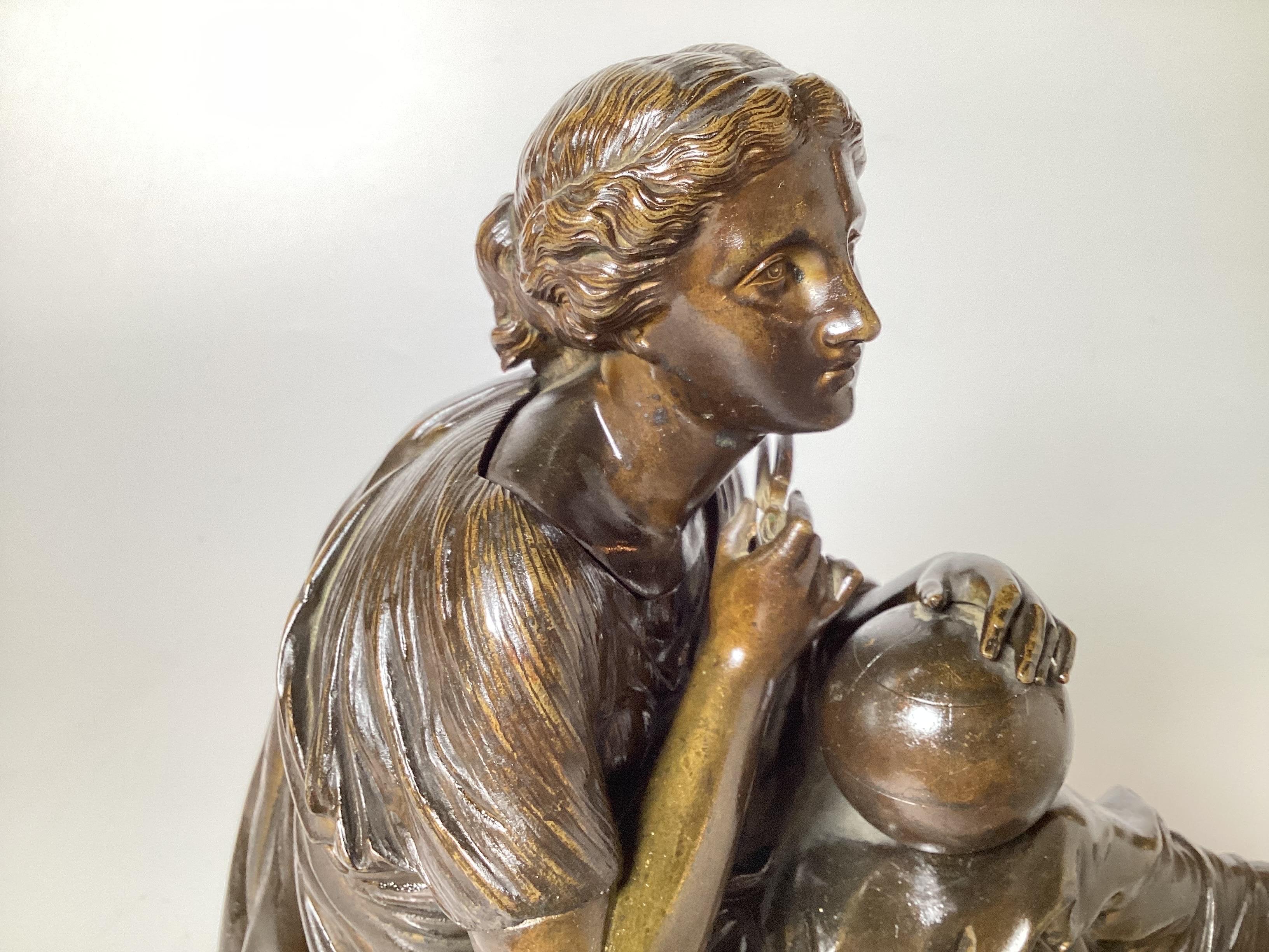 A Bronze Sculpture of a Seated Female Scholar, France Late 19th Century In Good Condition For Sale In Lambertville, NJ