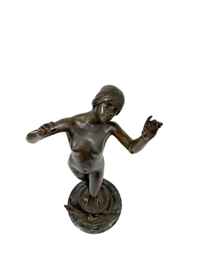 A bronze statue by Charles Louchet, France (1854-1936)

A standing female naked, looking up with her arms up. A beautiful graceful movement in bronze on a marble base.
Signed by Charles Louchet (1854-1936), a French jeweler, sculptor and bronze