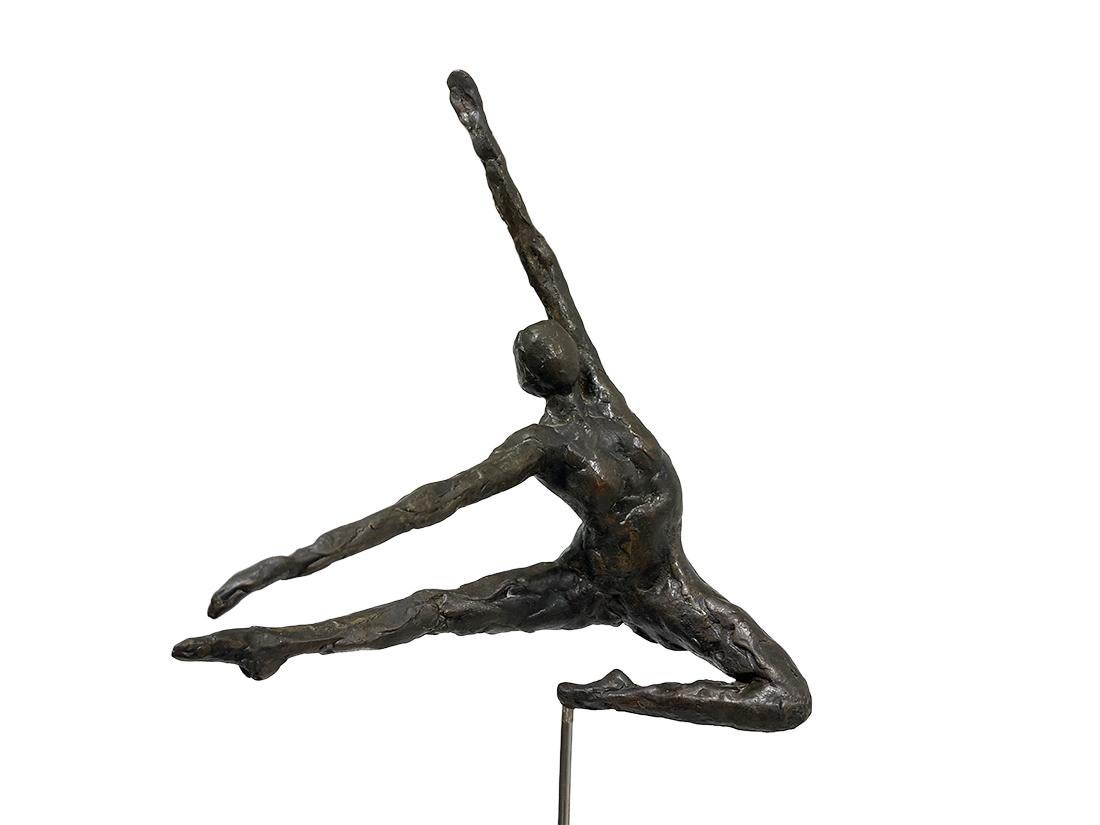 A bronze statue of a ballerina

A beautiful abstract statue of a ballerina made in bronze on a rectangular base. The bronze ballerina in a beautiful pose of a dancing jump, mounted on a steel pin on a stone base. (the base shows some traces of
