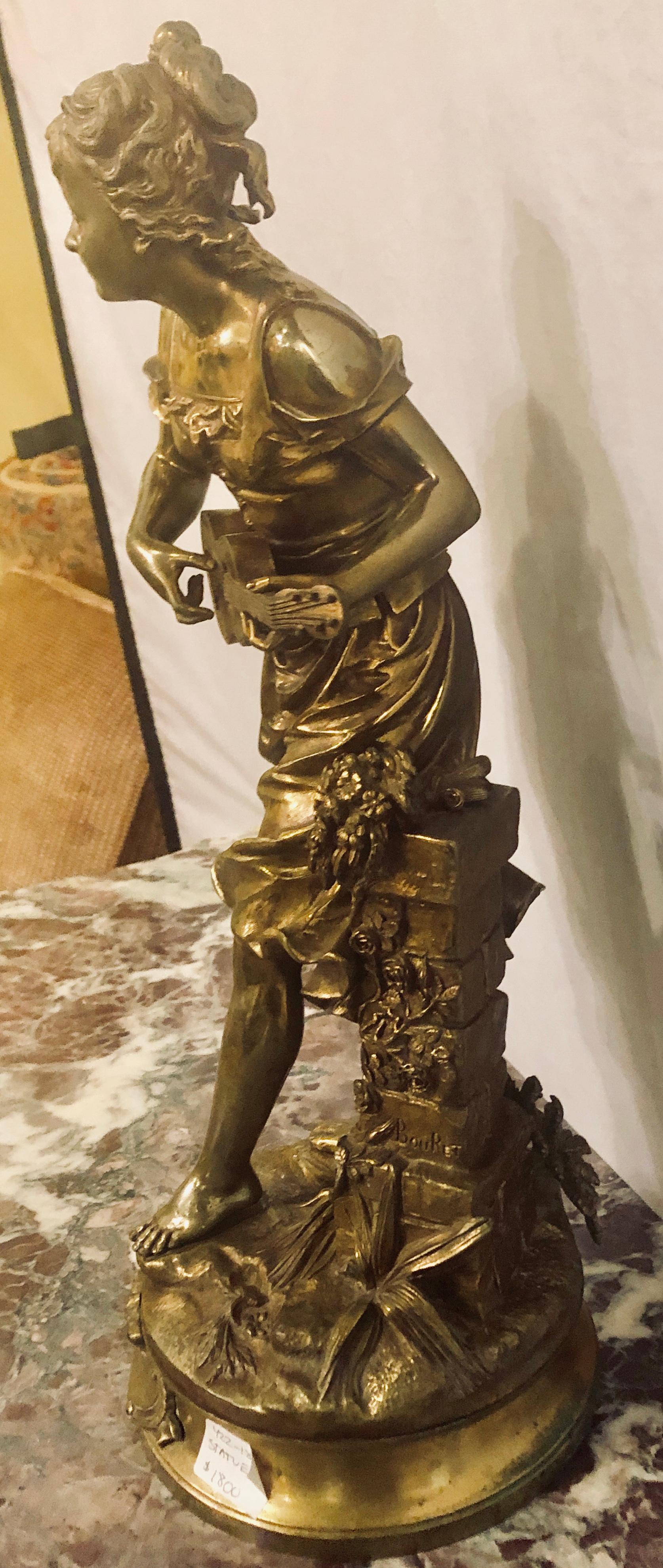 A bronze statue of a Young Lady Signed 