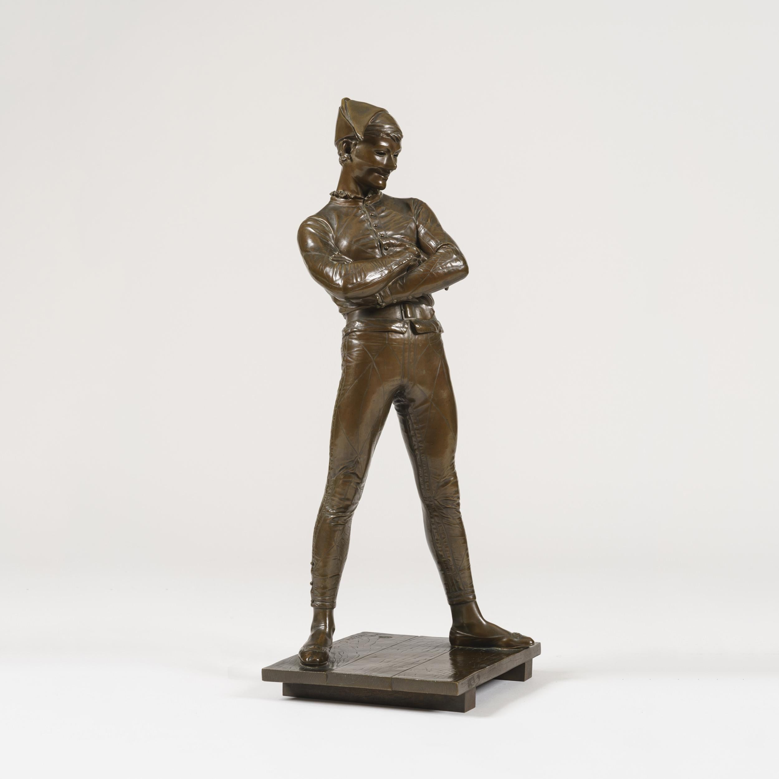 A bronze Statuette of Arlequin
by Charles-René de Paul de Saint-Marceaux

Cast by Barbedienne. The mischievous Harlequin, arms crossed in contemplation, wearing a grin and a mask, treading the boards of the stage, as befits his leading place in the