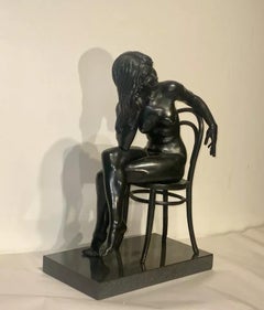 A Bronze Study of a Nude Woman Seated with Long Flowing Hair by Ronald Cameron