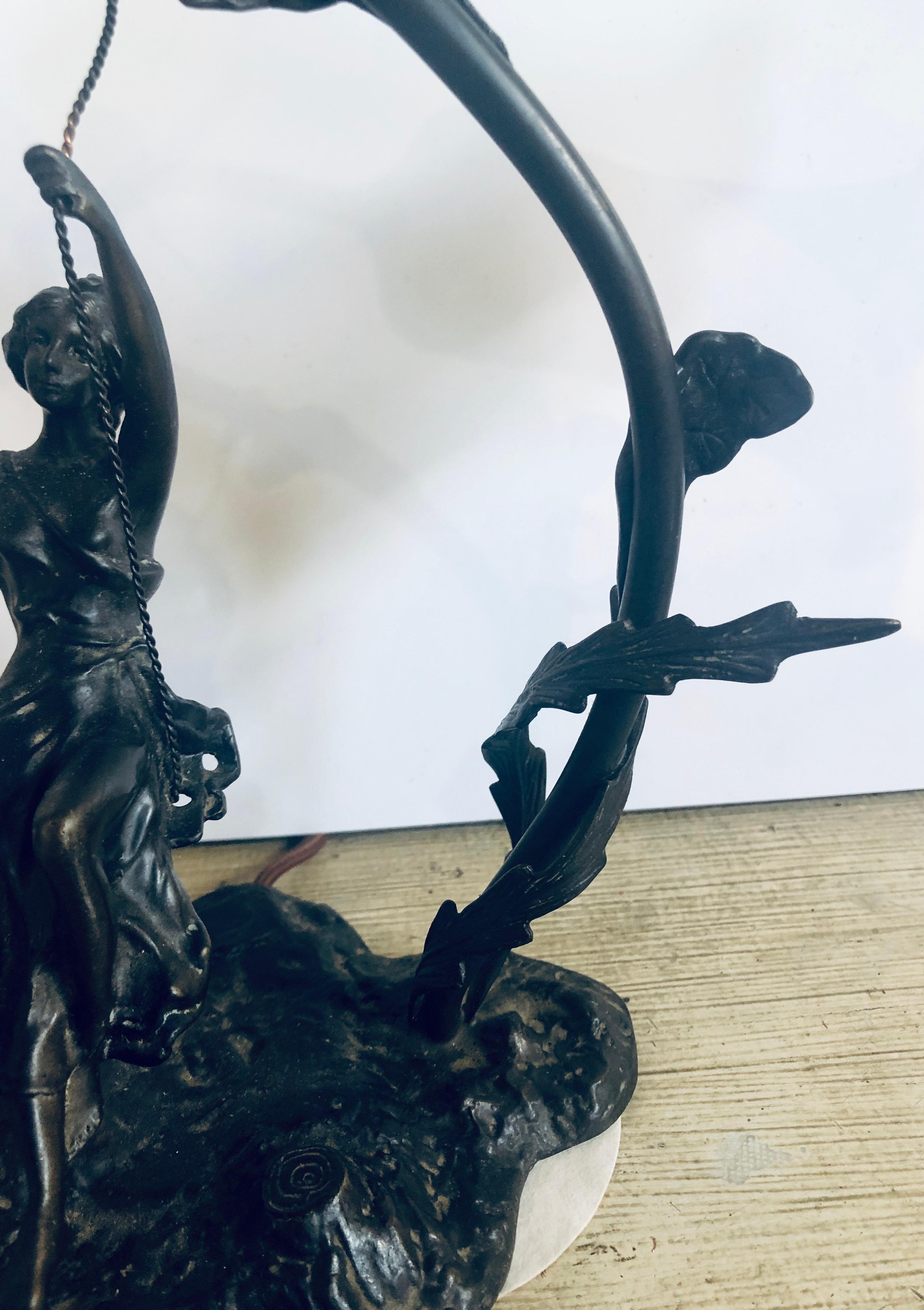 German Bronze Table Lamp Depicting a Girl on a Swing w a Tiffany Style Glass Shade