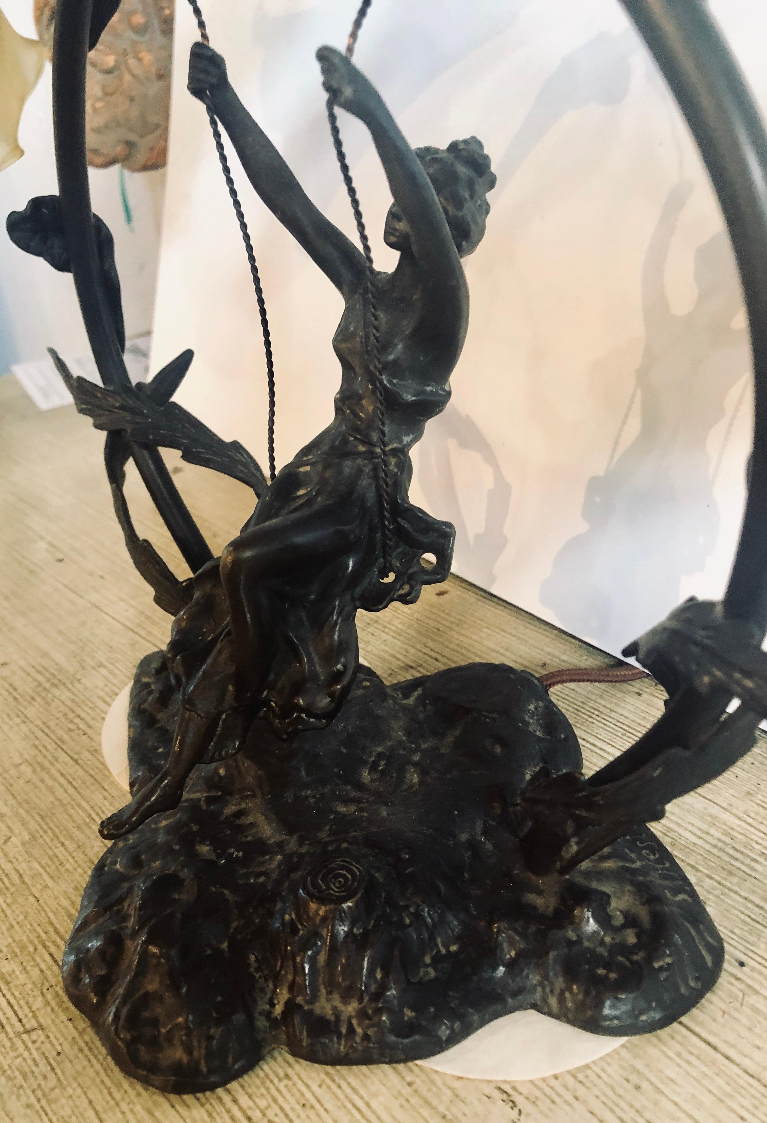 Metal Bronze Table Lamp Depicting a Girl on a Swing w a Tiffany Style Glass Shade
