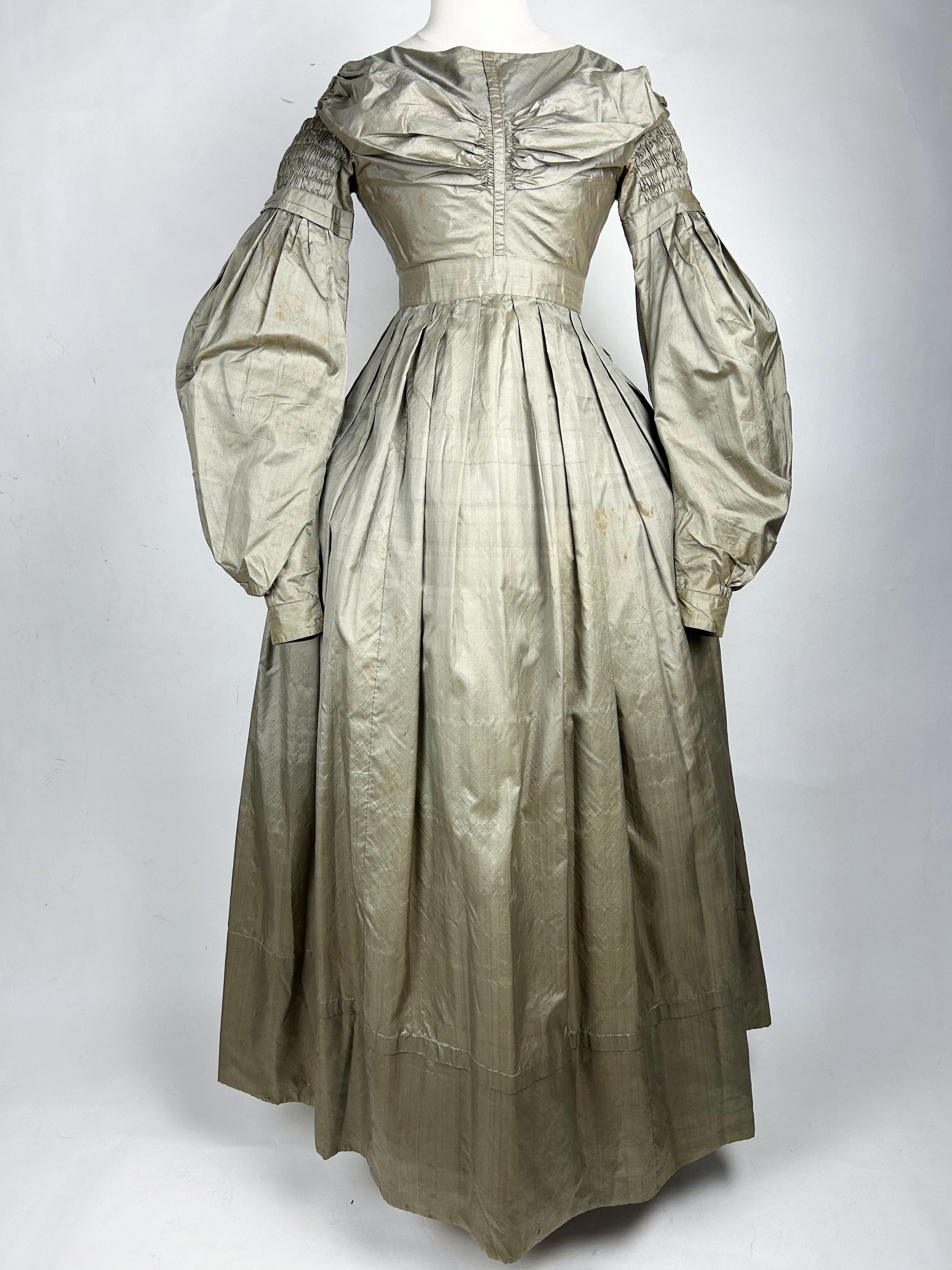 Gray A bronze taffetas day dress with mutton's sleeves - France Circa 1840