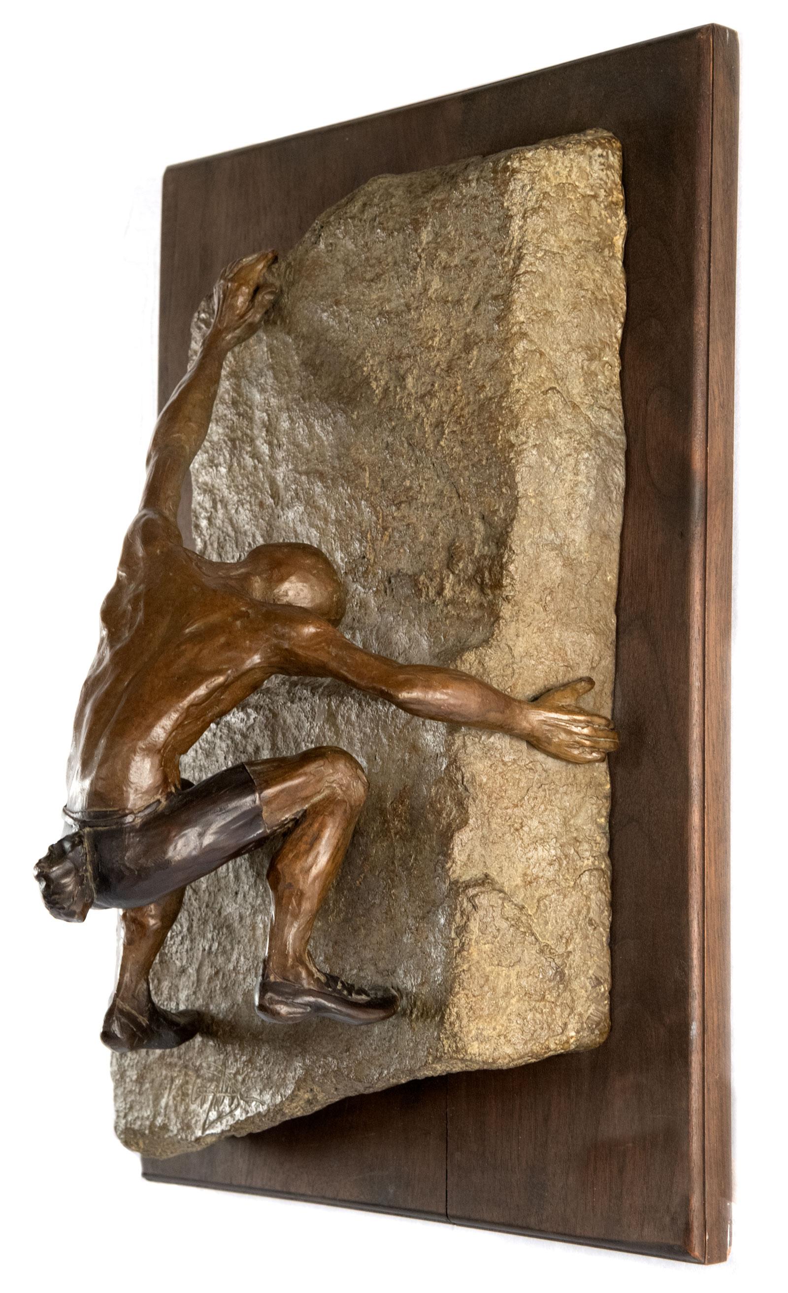 A bronze wall sculpture of a rock climber, signed lower right.

Jim Rennert was born in 1958, and grew up in Las Vegas, Nevada, and Salt Lake City, Utah. After 10 years of working in business Jim started sculpting in 1990. He had his first bronze