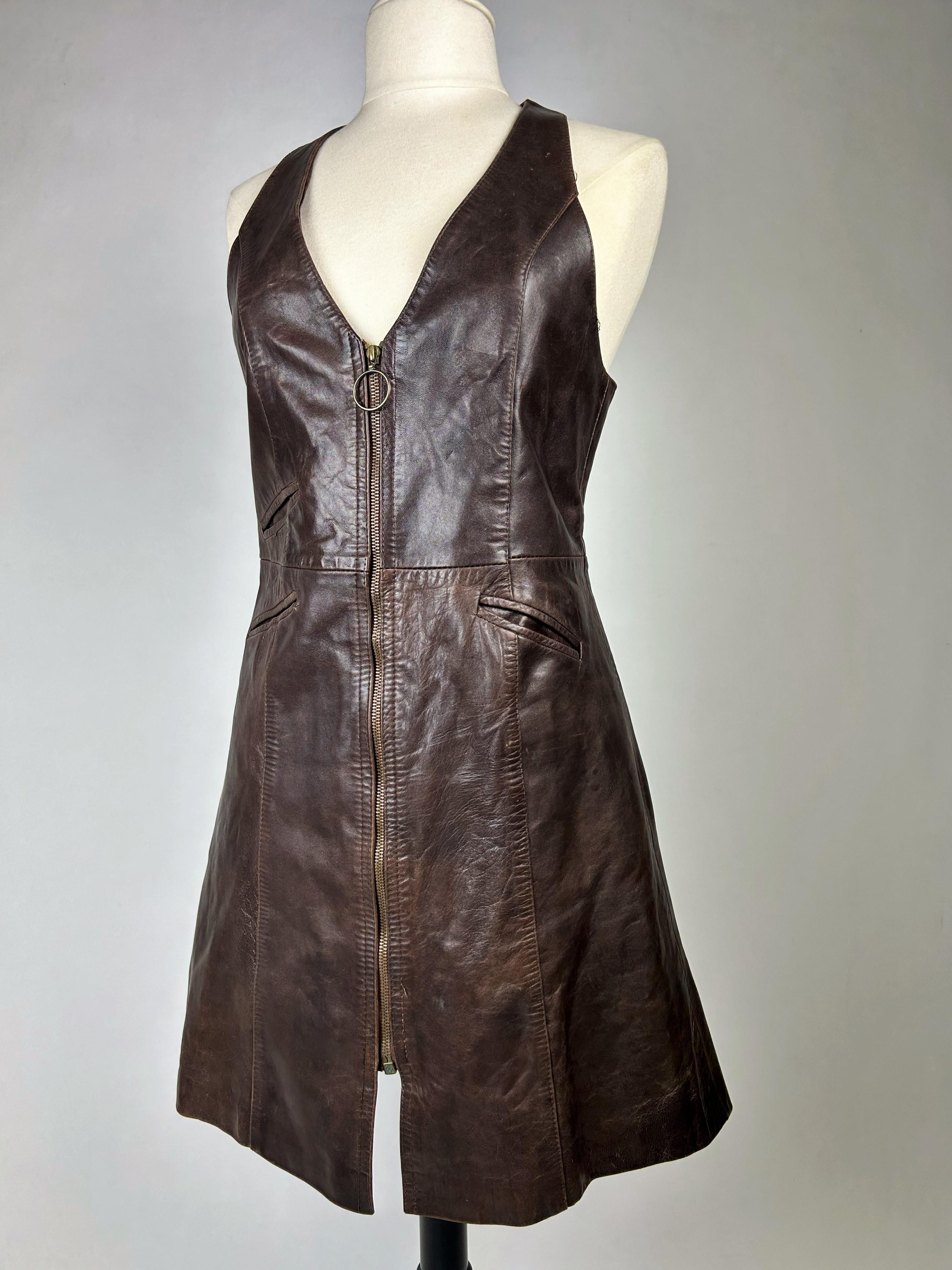 Circa 1975

Europe

Brown lamb leather tunic mini-dress by Rollanfer, dating from the 1970s. Fitted cut with a flared yoke at the bottom. Athletic 