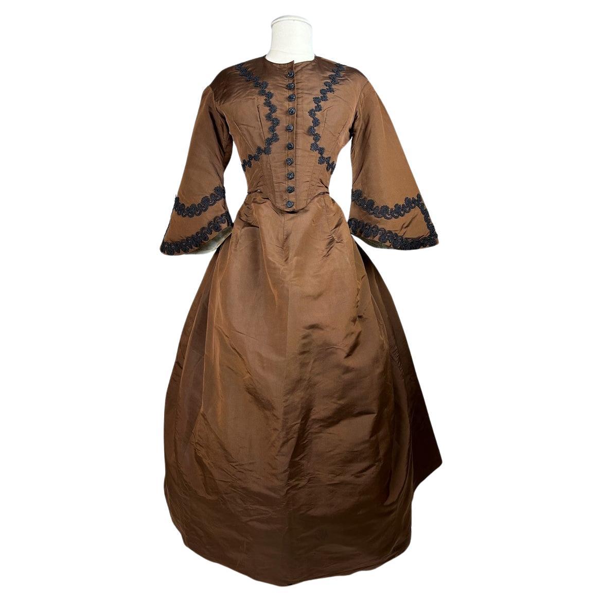 A brown silk faille day dress with pagoda sleeves - France Circa 1880 For Sale