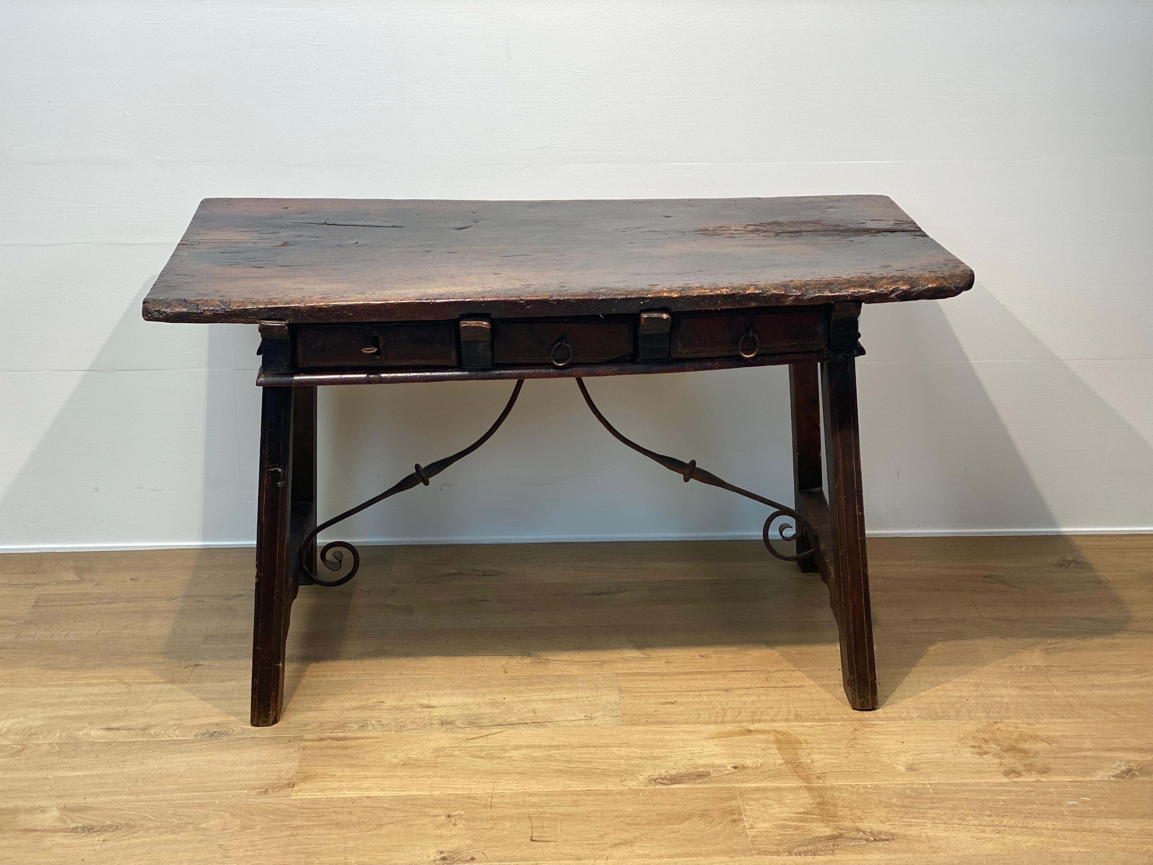 A superb Spanish , brutalist, antique table from the Catalan Region,
great patina and shine of the wood,warm color pattern,
great tabletop because of the used wood,
table with a lot of character and power,
the table has 3 drawers and the typical