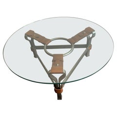A brutalist coffee table in iron and leather