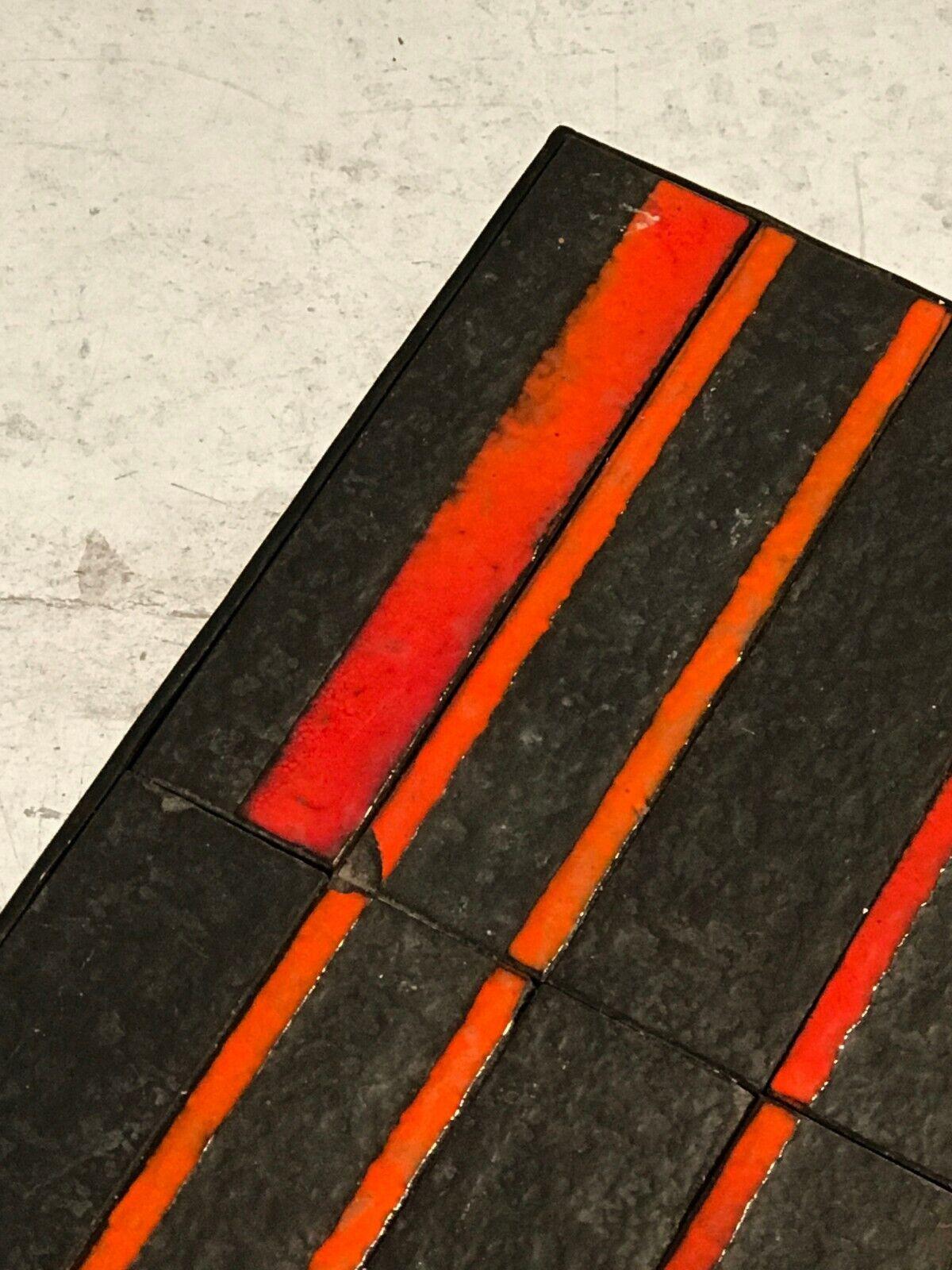 A rigorous and graphic rectangular coffee table, Moderniste, Bauhaus, Reconstruction, impressive constructivist structure in black wrought iron, the tray in lava stripes enameled with scarlet red rectangular motives, remembering Roger Capron's