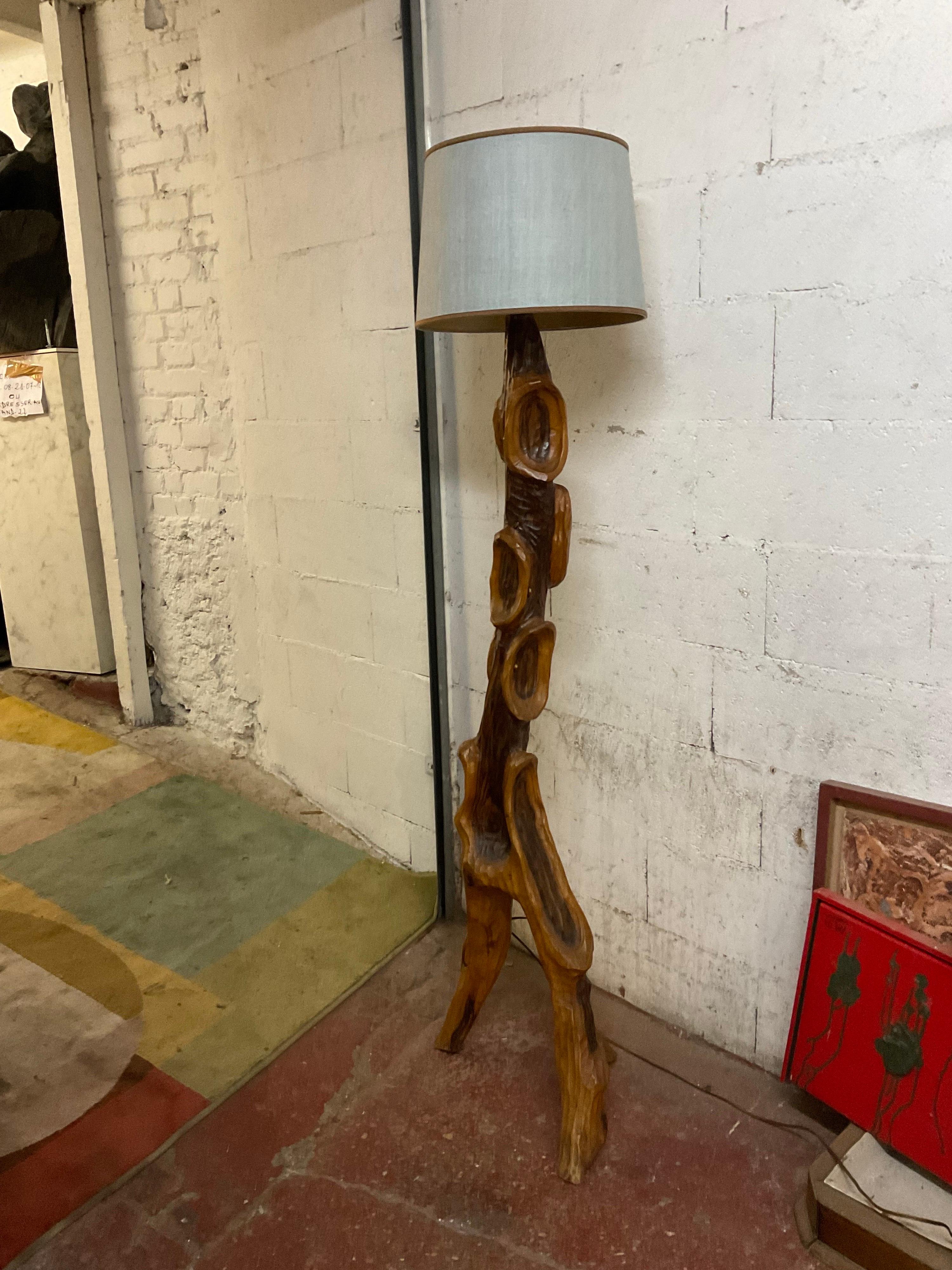 An olive floor lamp not original shade.
