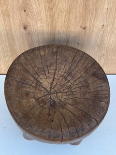 A brutalist low stool