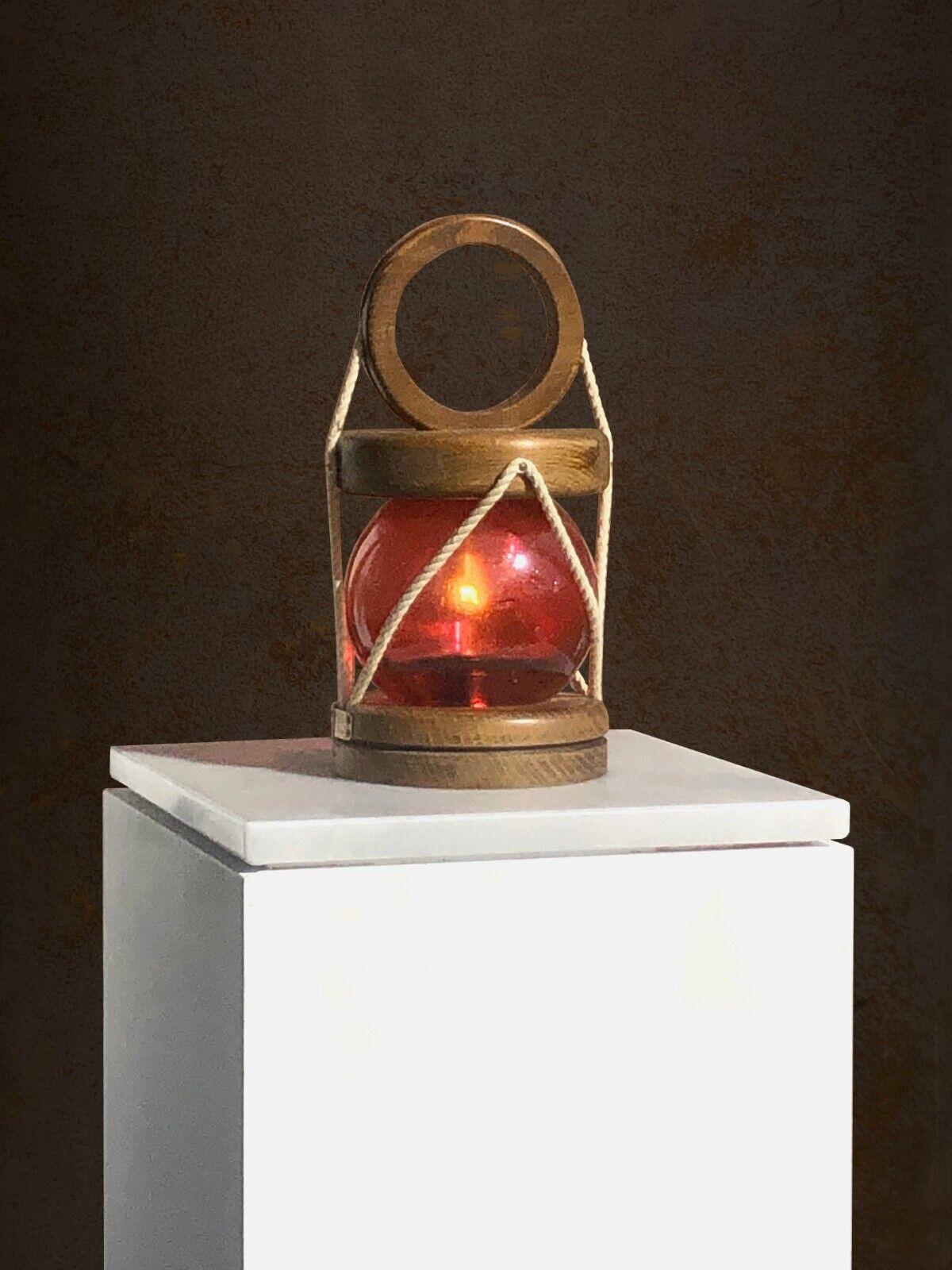 A small and charming Table Lamp, Night Light or Lantern, Modernist, Rustic-Modern, Art-Popular, Brutalist, Shabby-Chic, circular wooden base, body in a ball of red blown glass from Biot structured by fine ropes, lid with particularly graphic
