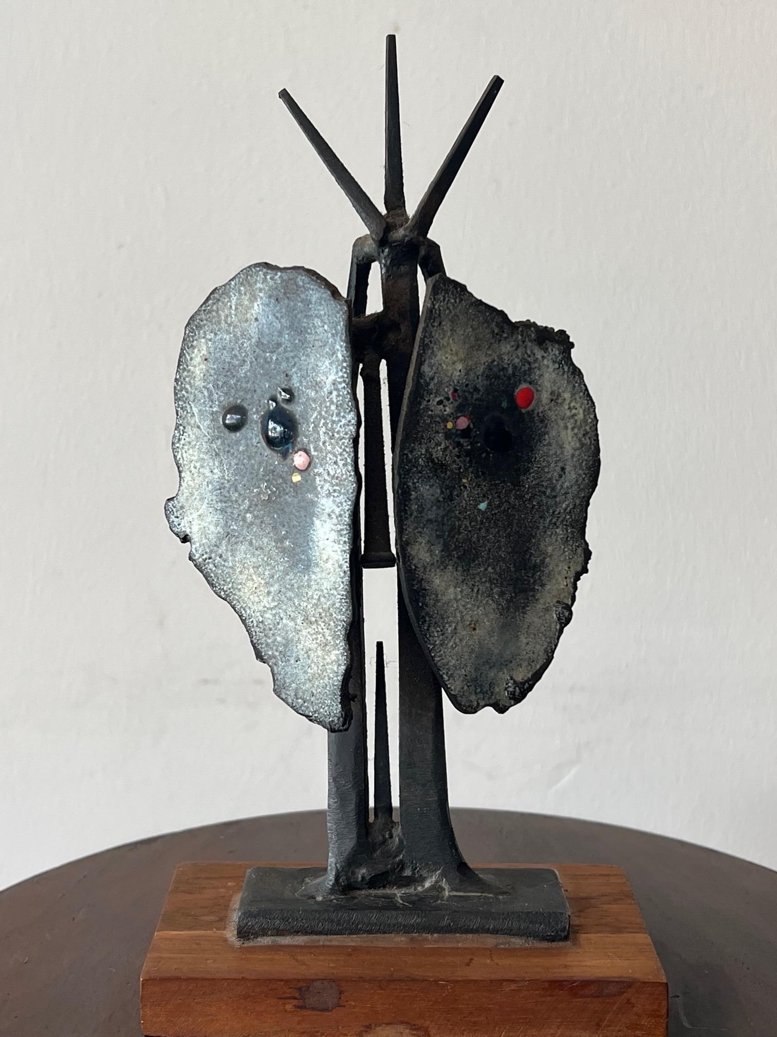 A whimsical, figurative bronze sculpture by a noted artist Chet LaMore.  