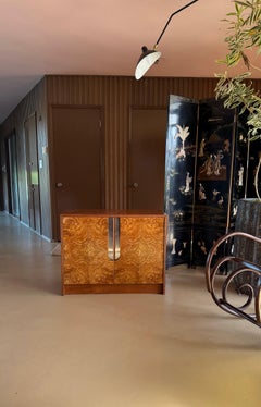 A burl wood and chrome cabinet / chest of drawers by Milo Baughman, circa 1970