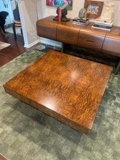 A burl wood coffee table in the style of Milo Baughman, circa 1970s