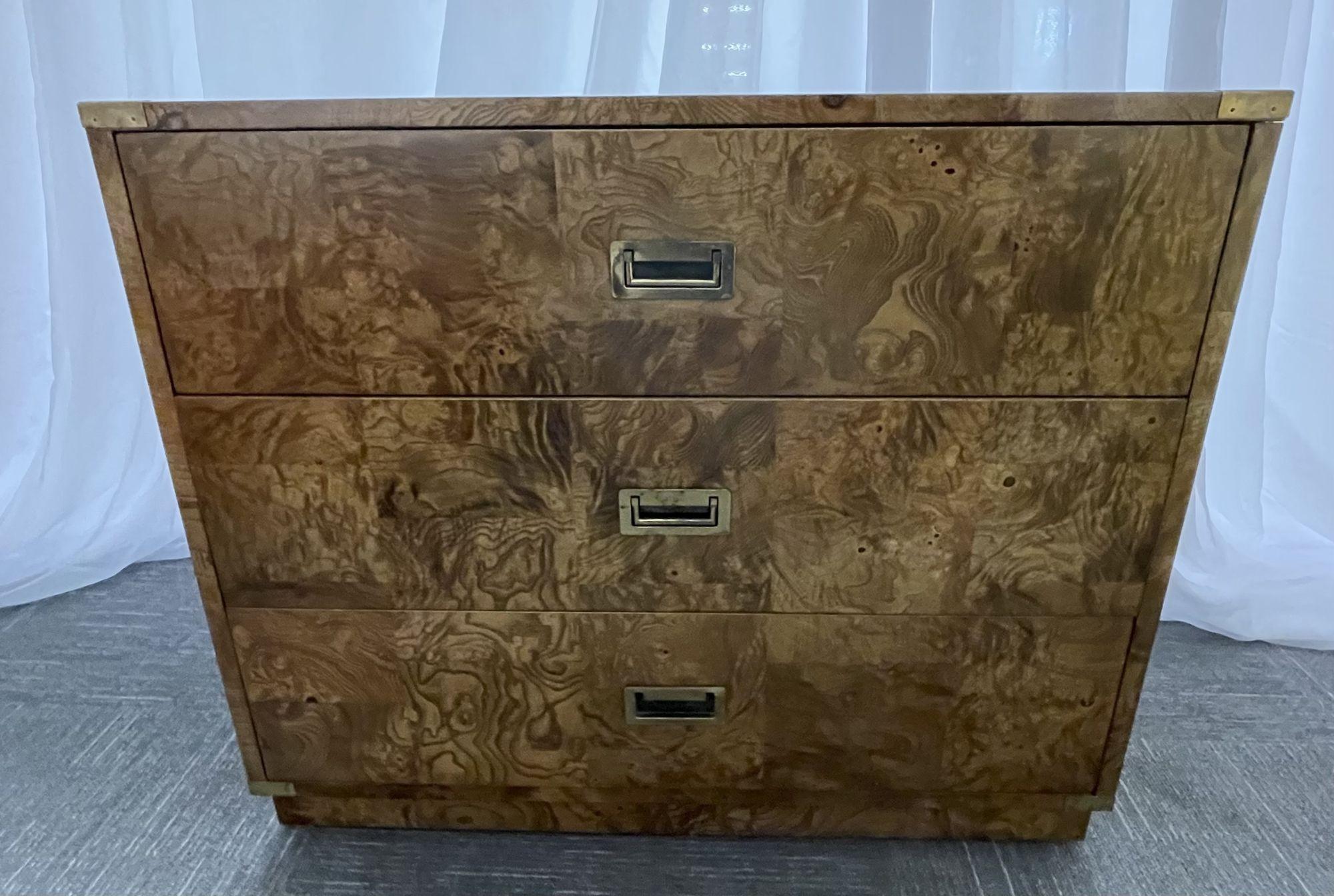 A Burlwood campaign chest, nightstand or end table.
 
Burlwood campaign chest with three drawers and elegant brass hideaway pulls by Bernhardt; fully refinished.