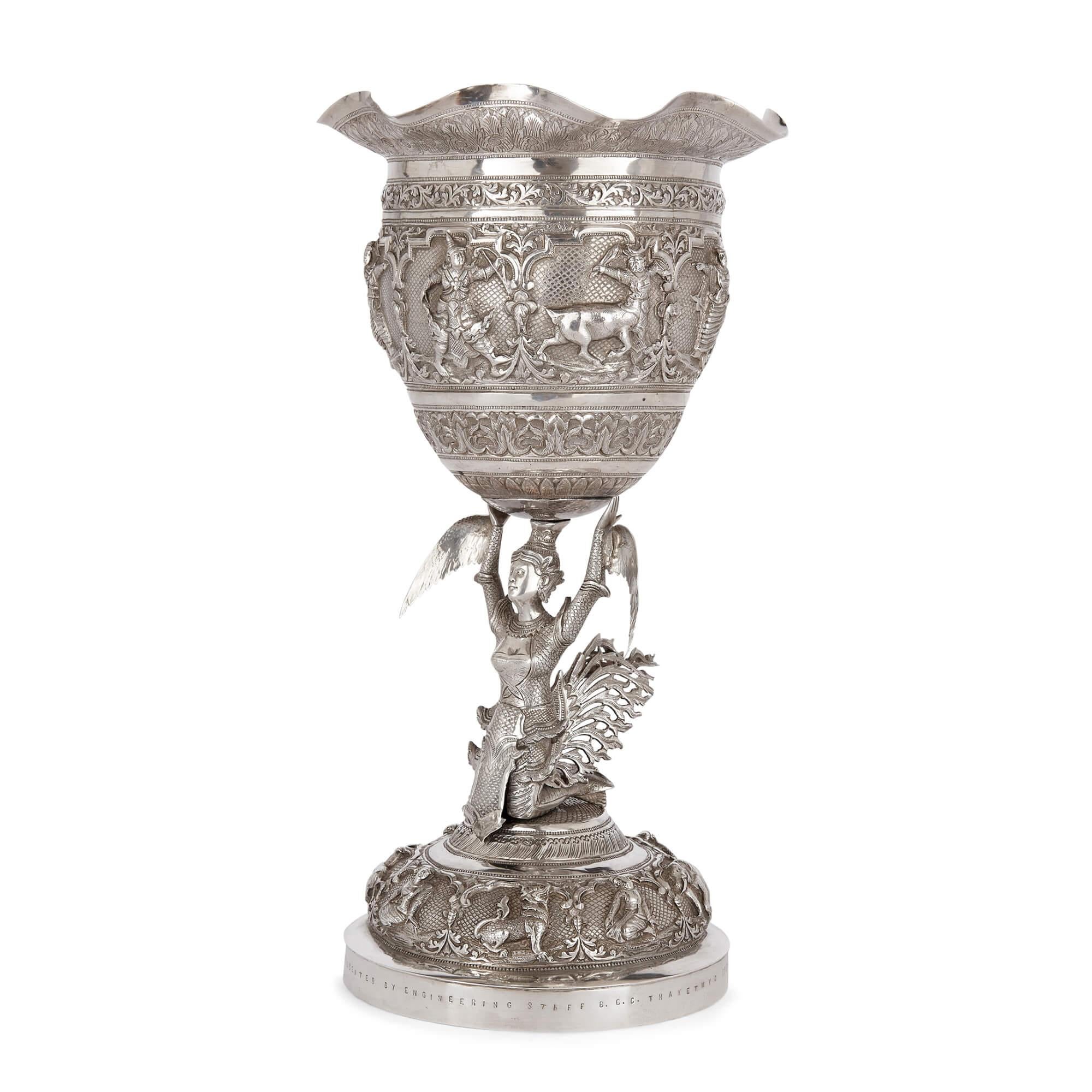 A Burmese embossed silver presentation chalice
Burmese, early 20th century
Measures: Height 31cm, diameter 16.5cm, weight 937 grams

This remarkable and beautiful silver chalice, or trophy, was made in Burma in the late 1930s and offers a