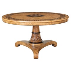 A Burr Elm and Ebony Inlay Circular Centre Table