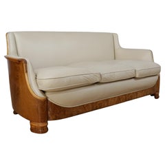 A Burr Walnut and Cream Leather Art Deco Sofa by Maurice Adams